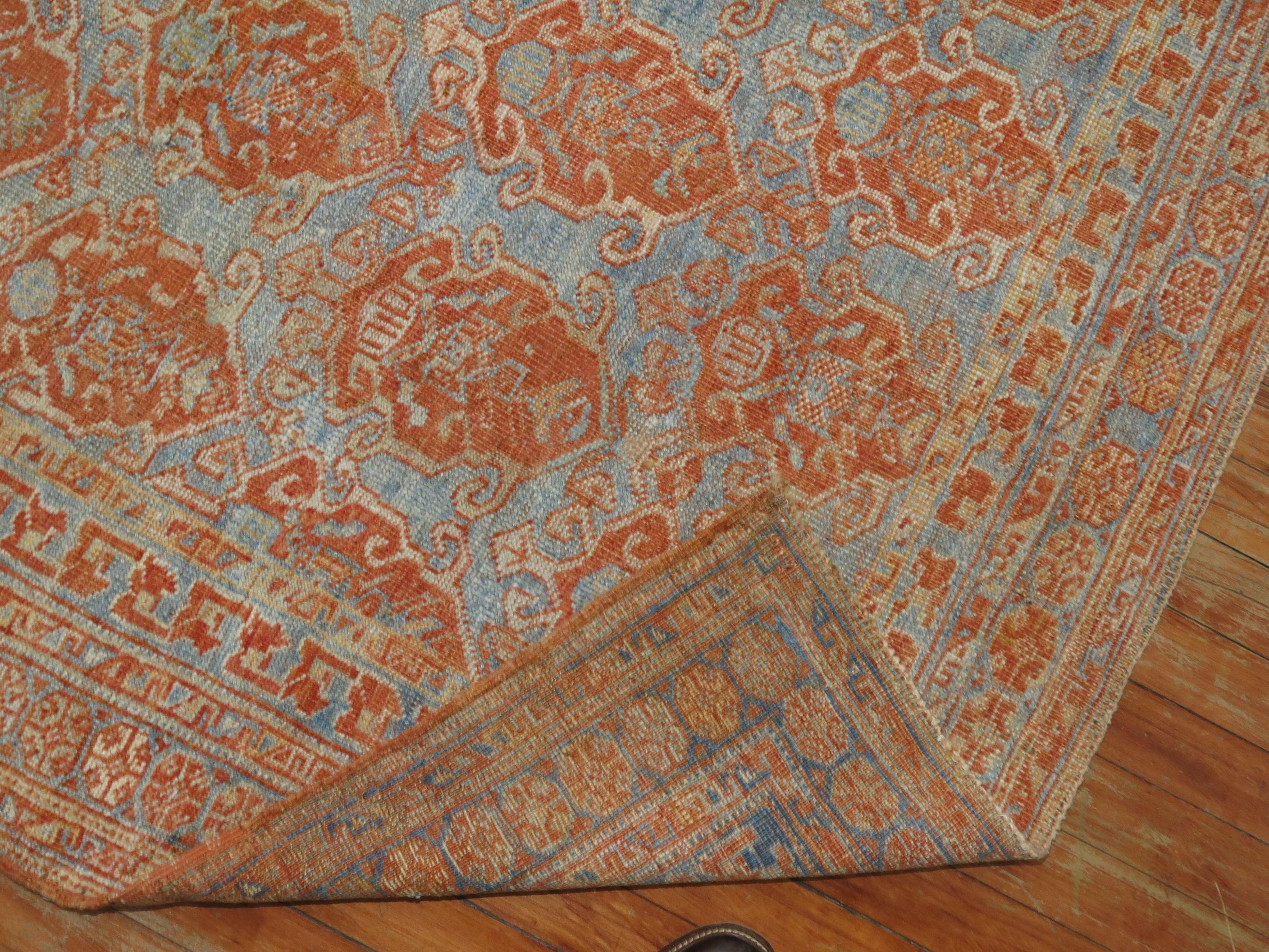 An early 20th century Persian Afshar Tribal rug in sky blue and terracotta tones, circa 1930.

Measure: 4'4'' x 4'10''.