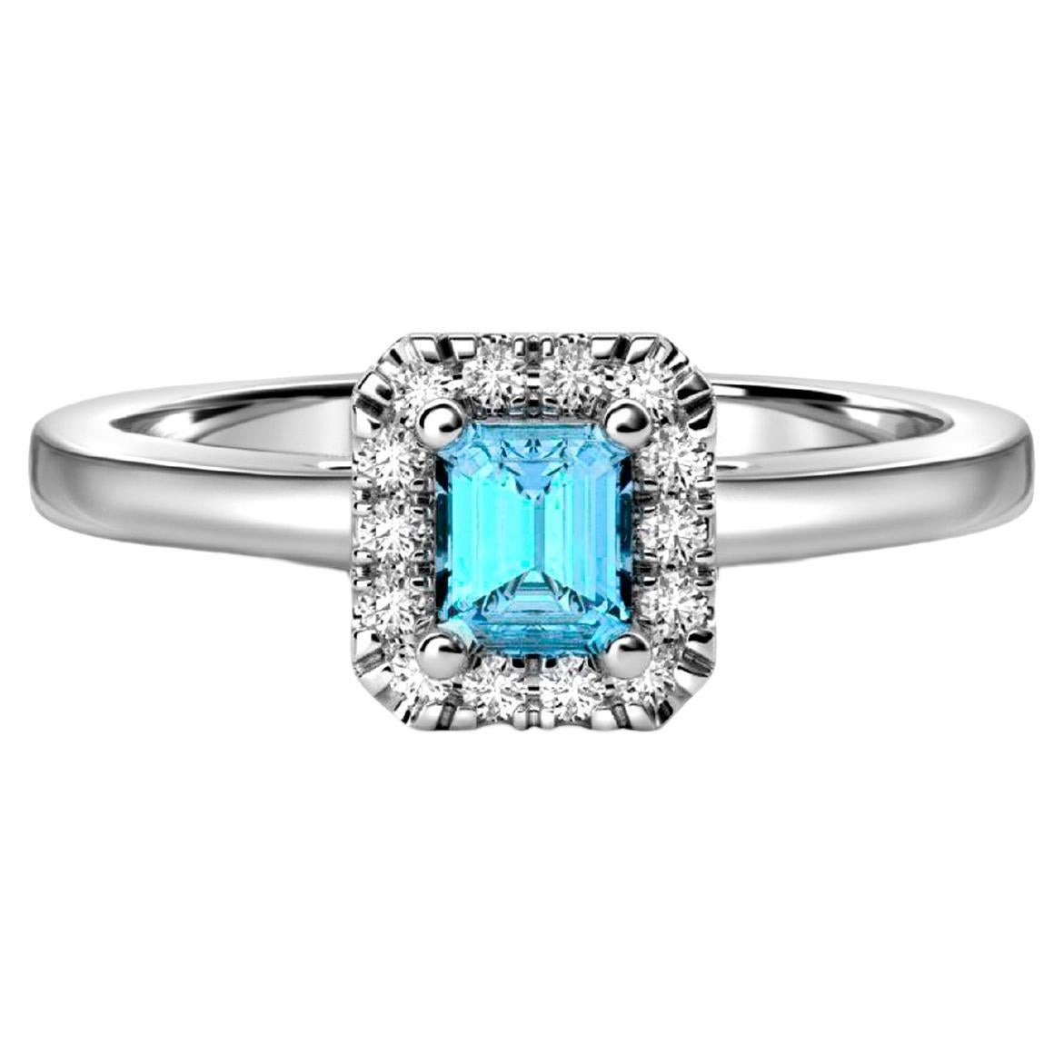 Anello in oro 14k con topazio azzurro.