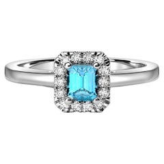 Anello in oro 14k con topazio azzurro.