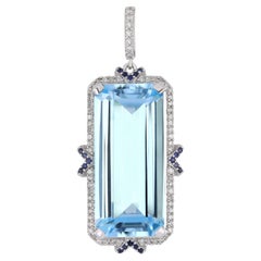 Sky Blue Topaz, Blue Sapphire and Diamond Studded Pendant in 14 K White Gold