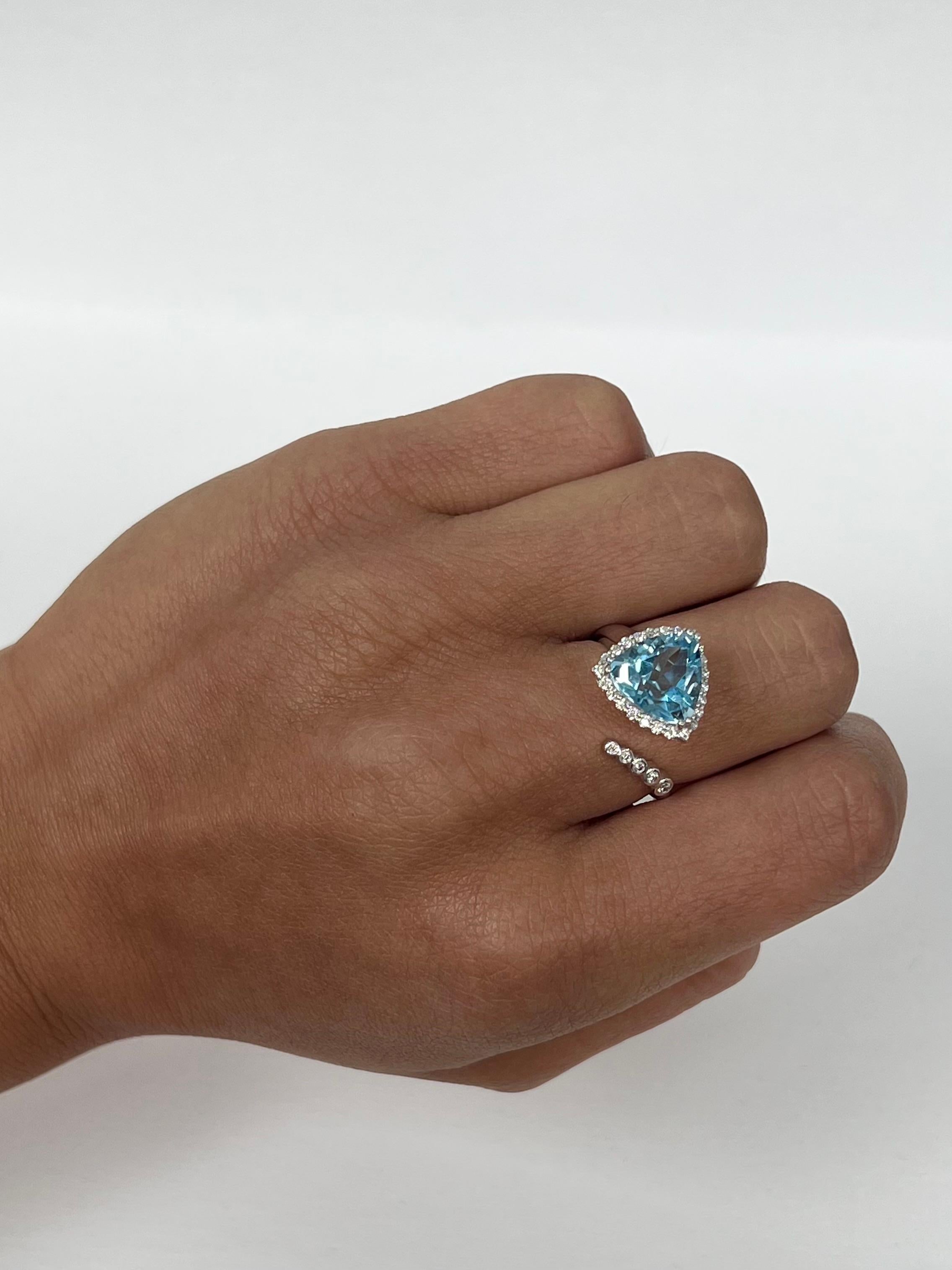 Modern Sky Blue Topaz White Gold Bypass Diamond Ring For Sale