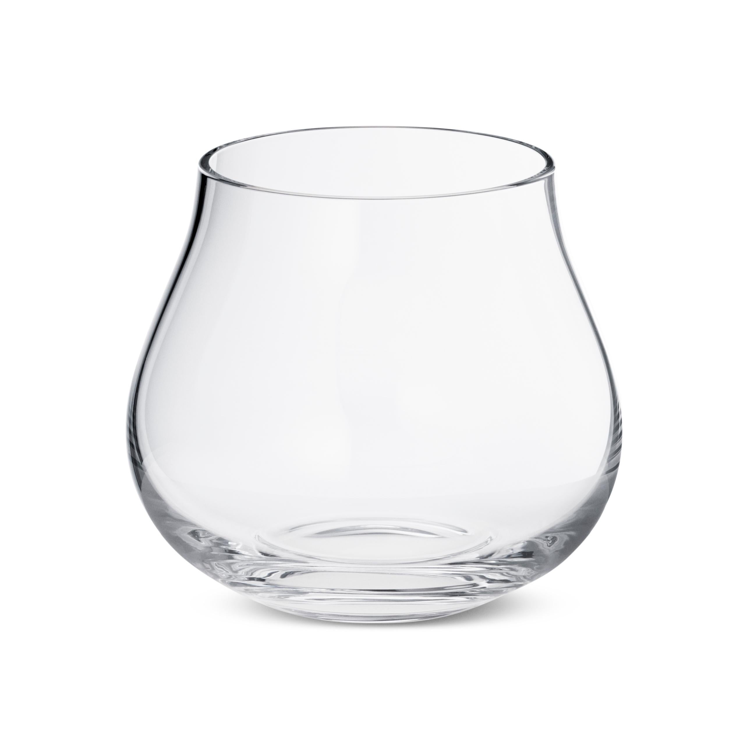 A perfect example of contemporary Scandinavian design, this set of six lead-free crystal tumblers combines sophisticated good looks with true functionality. The organic shape adds a sculptural aspect to the dining table and also feels comfortable in