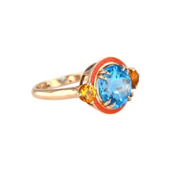 Bague design Art déco haute couture émaillée de corail, topaze ciel et citrine