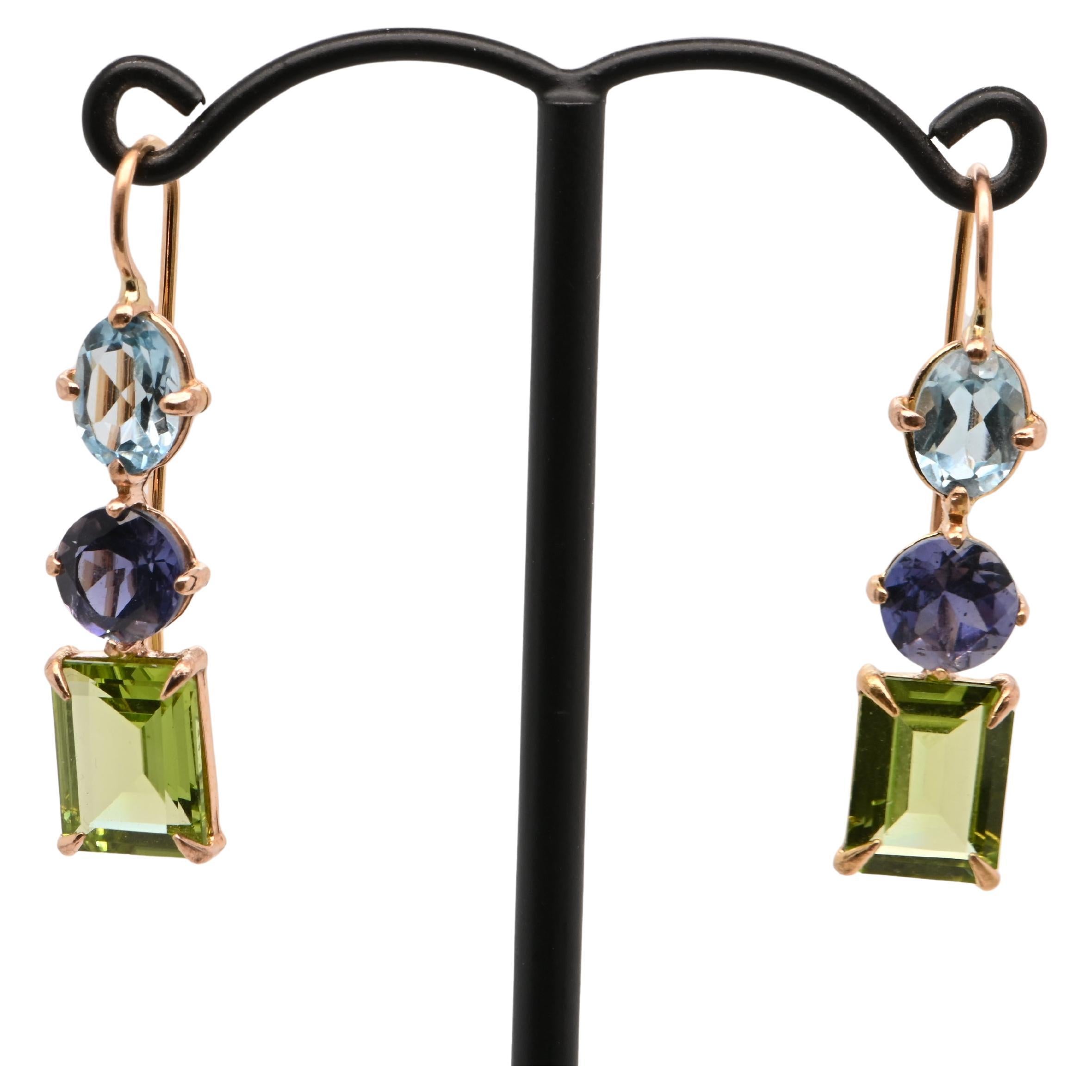 Sky Topaz, Iolite, and Peridot Rose Gold Earrings

These stunning drop earrings embody elegance and sophistication, perfect for special occasions or adding a touch of brilliance to everyday looks. Meticulously crafted, they showcase the sparkle of