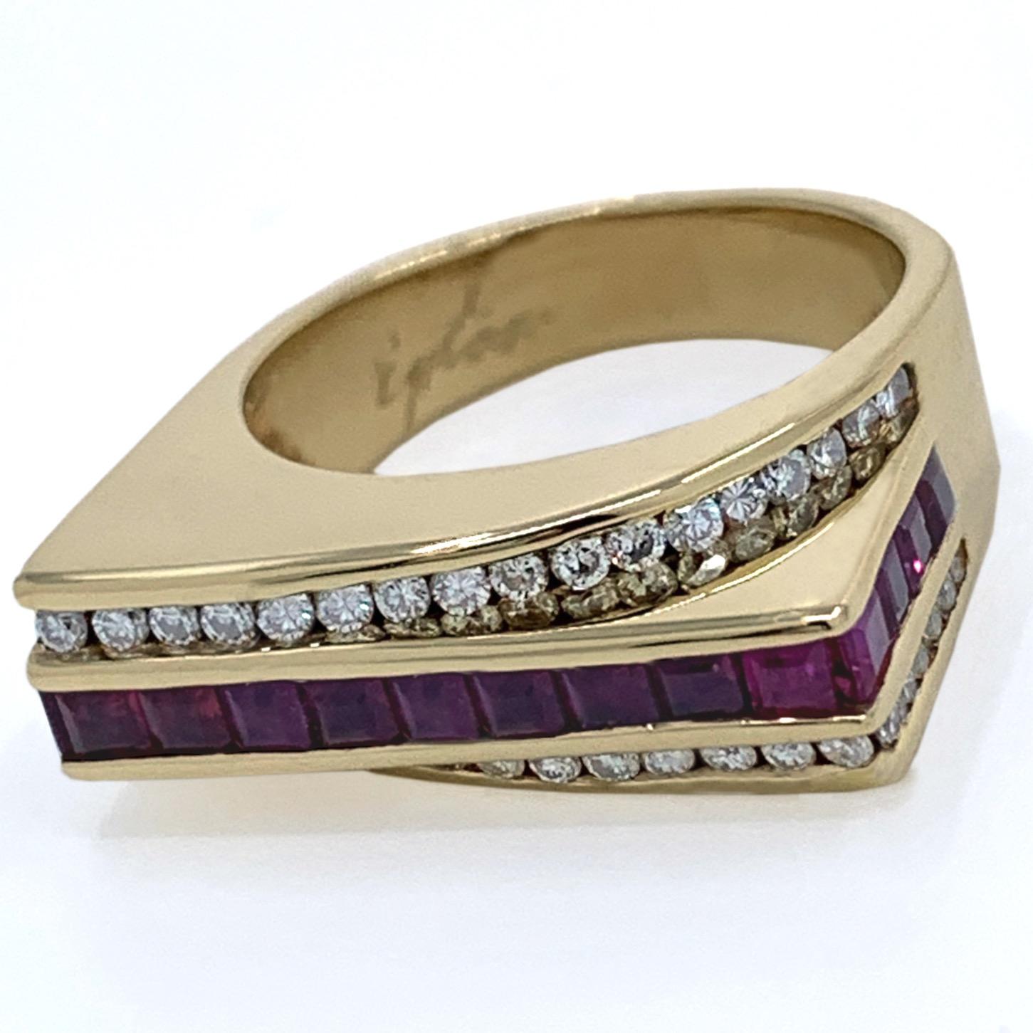 This cool, architectural ring by Eytan Brandes features two rows of channel-set diamonds sweeping in opposing arcs above and below a straight channel of rubies.  

Lots of color, contrast and sparkle packed into a narrow, dramatically elevated face,