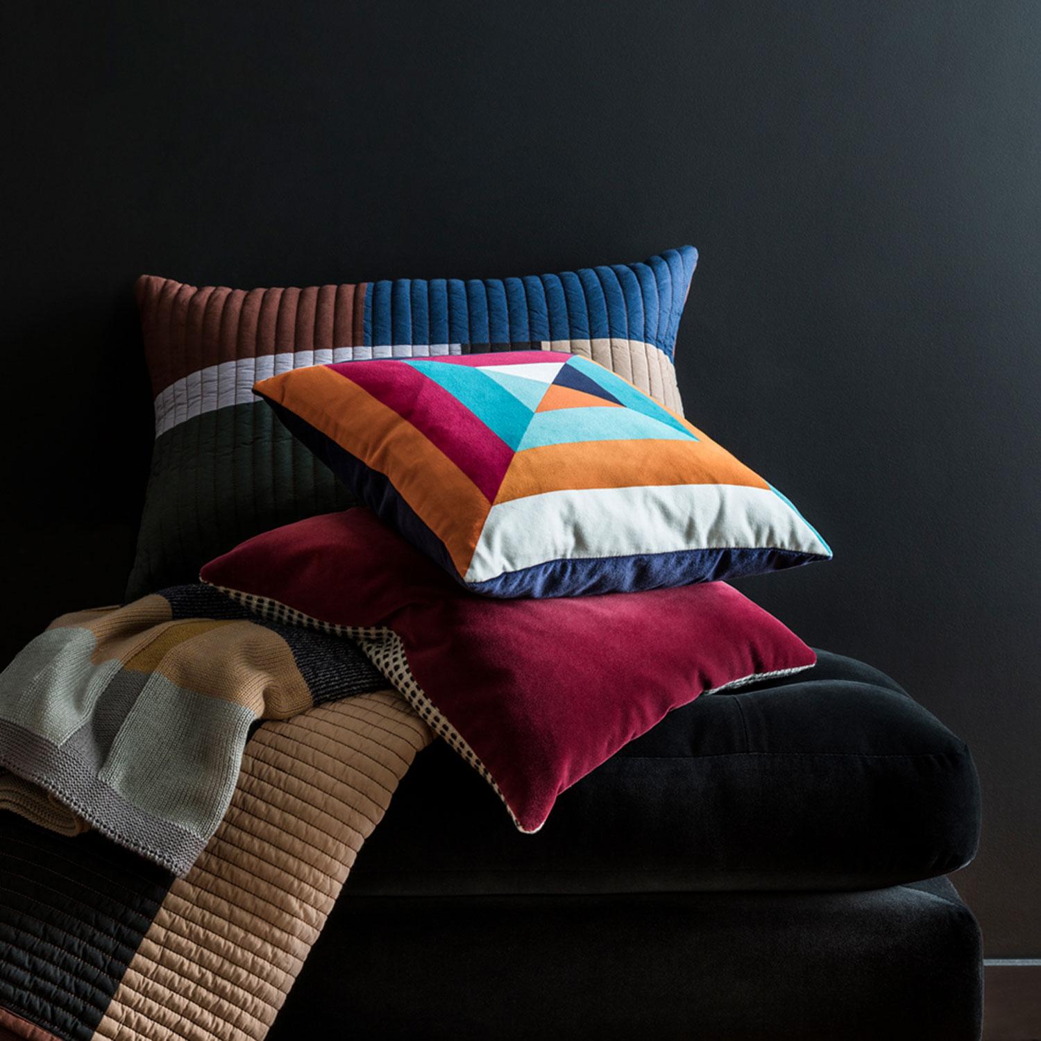 The Skye cushion is inspired by the traditions of Japanese origami. Playing with block sequence patterns and colours the result is a vibrant printed velvet cushion. The rich, bold colour palette creates a striking piece with a contemporary edge that