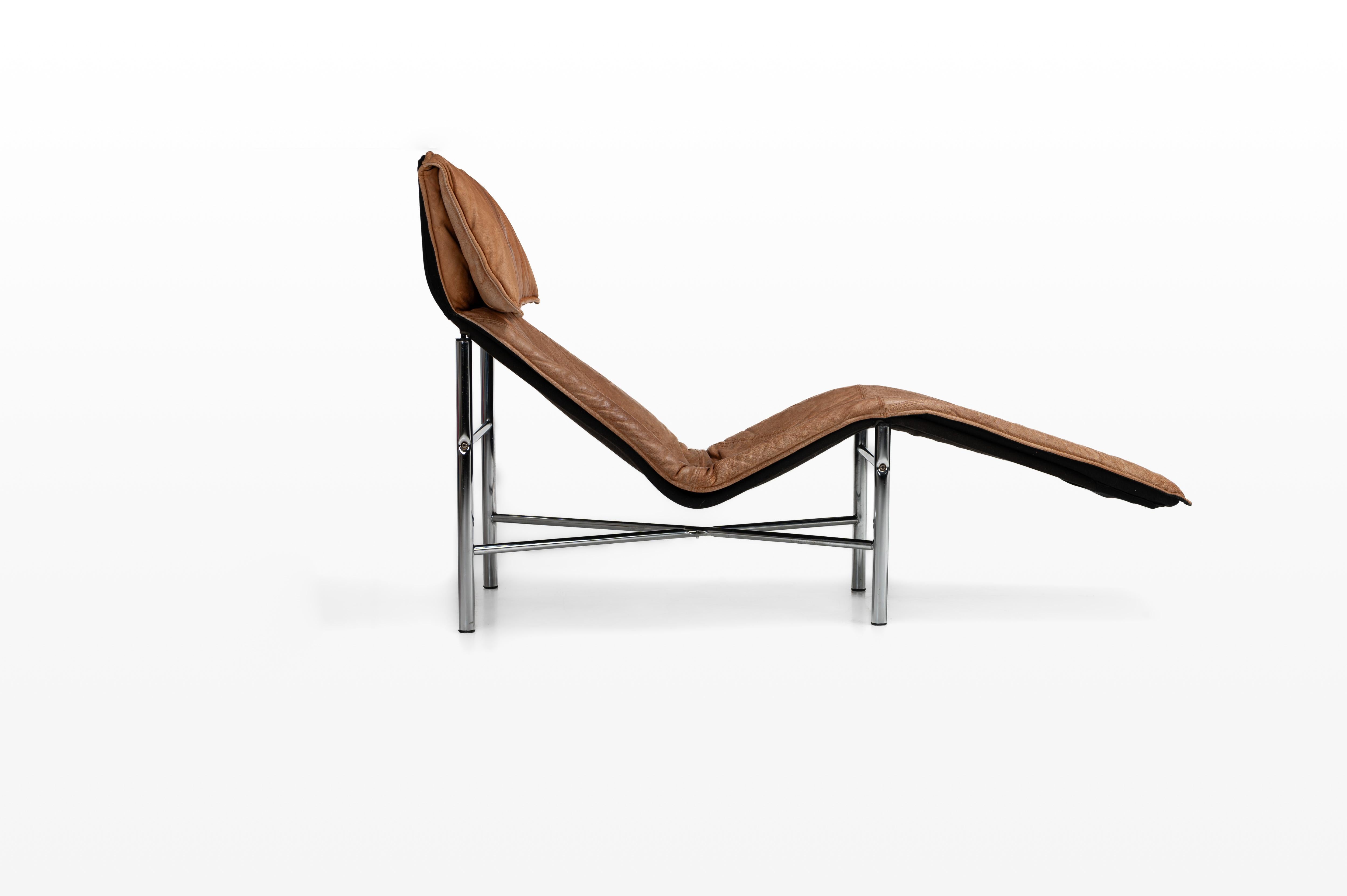 Super comfortable 'Skye' lounge chair by Tord Bjorklund for IKEA, 1980s. This lounge chair has a chrome base and a brown cognacleather seat. The lounge chair is in very good and original condition. Also available in dark grey