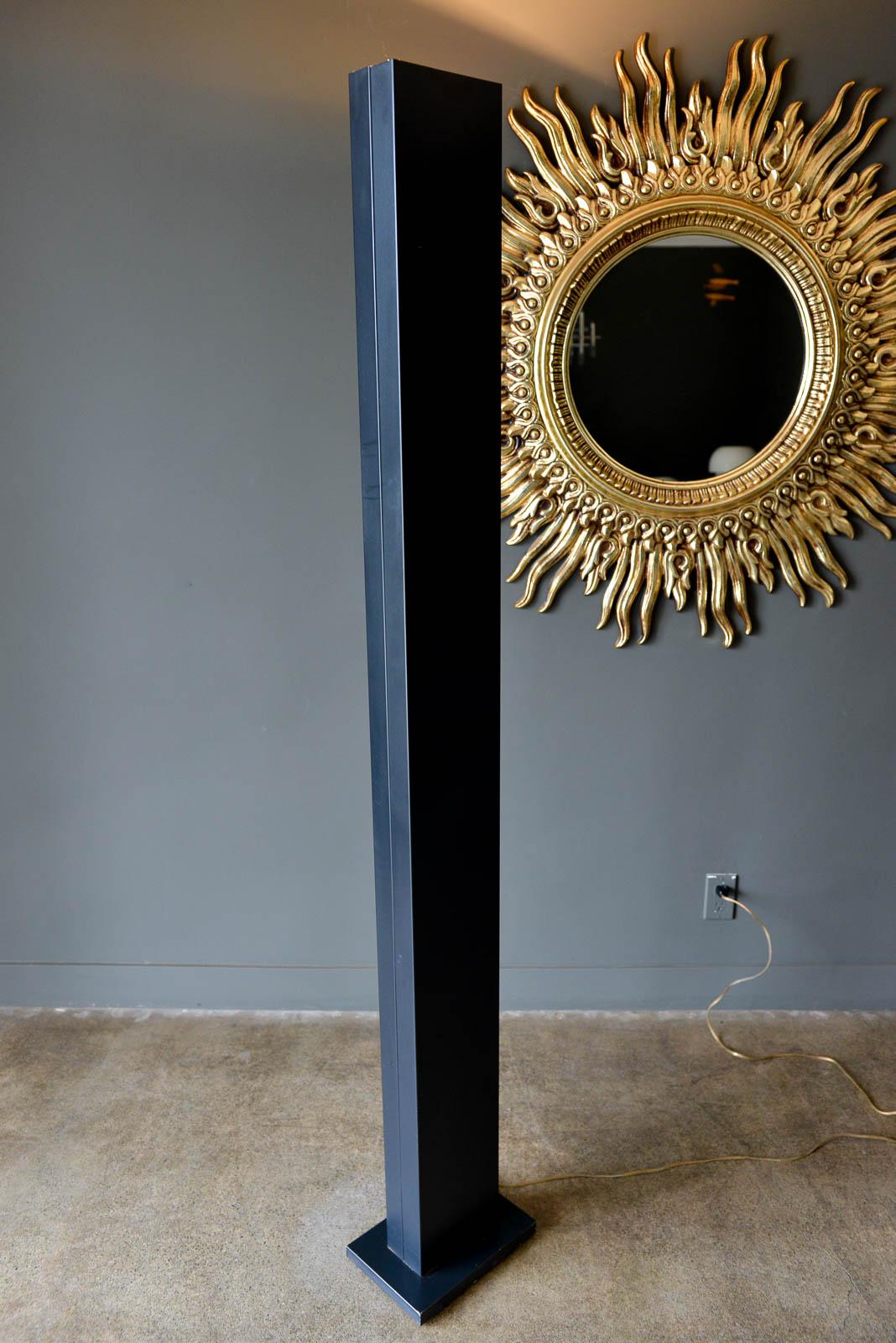 'Skyscraper' floor lamp by Casella, circa 1970. Black enameled metal torchiere style floor lamp with original wiring. Stands 72.5