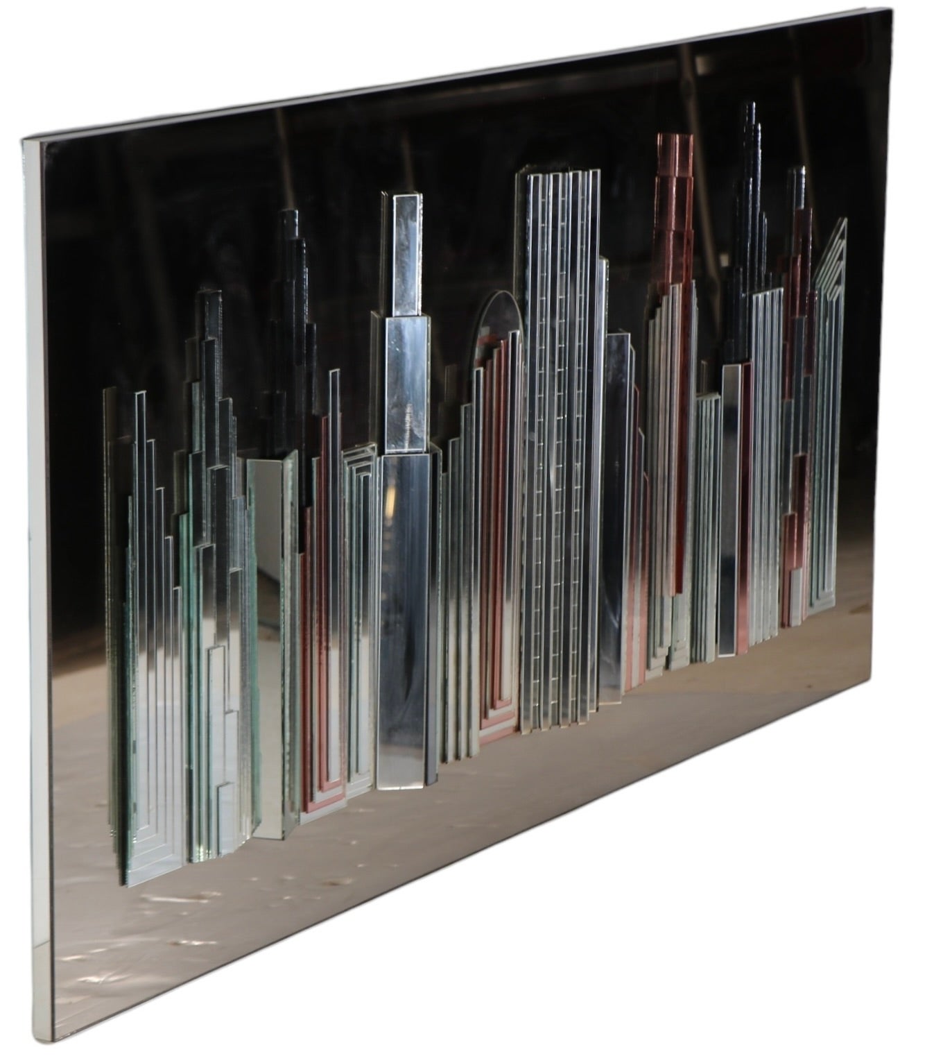 Incredible dimensional mirror depicting the New York Skyline, circa 1980's. This exceptional piece was made by artists Harvard and henry, for the Harvard Reflections company. This glamorous mirror is in very fine, original, clean and ready to hang