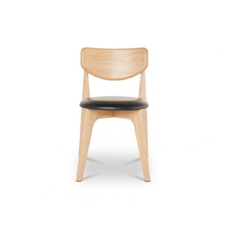 Slab is a stackable chair, made in Lithuania using solid wood oak. In a natural finish, this modern dining chair is upholstered using leather to maximise its comfort.
 