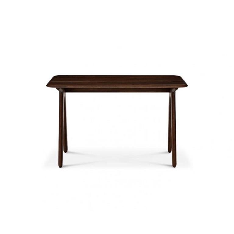 Inspired by the archetypical Victorian school desk, this contemporary work station is equally comfortable as a hotel room desk or a dressing table. Made from solid oak construction, with softly rounded edges and understated proportions, the
