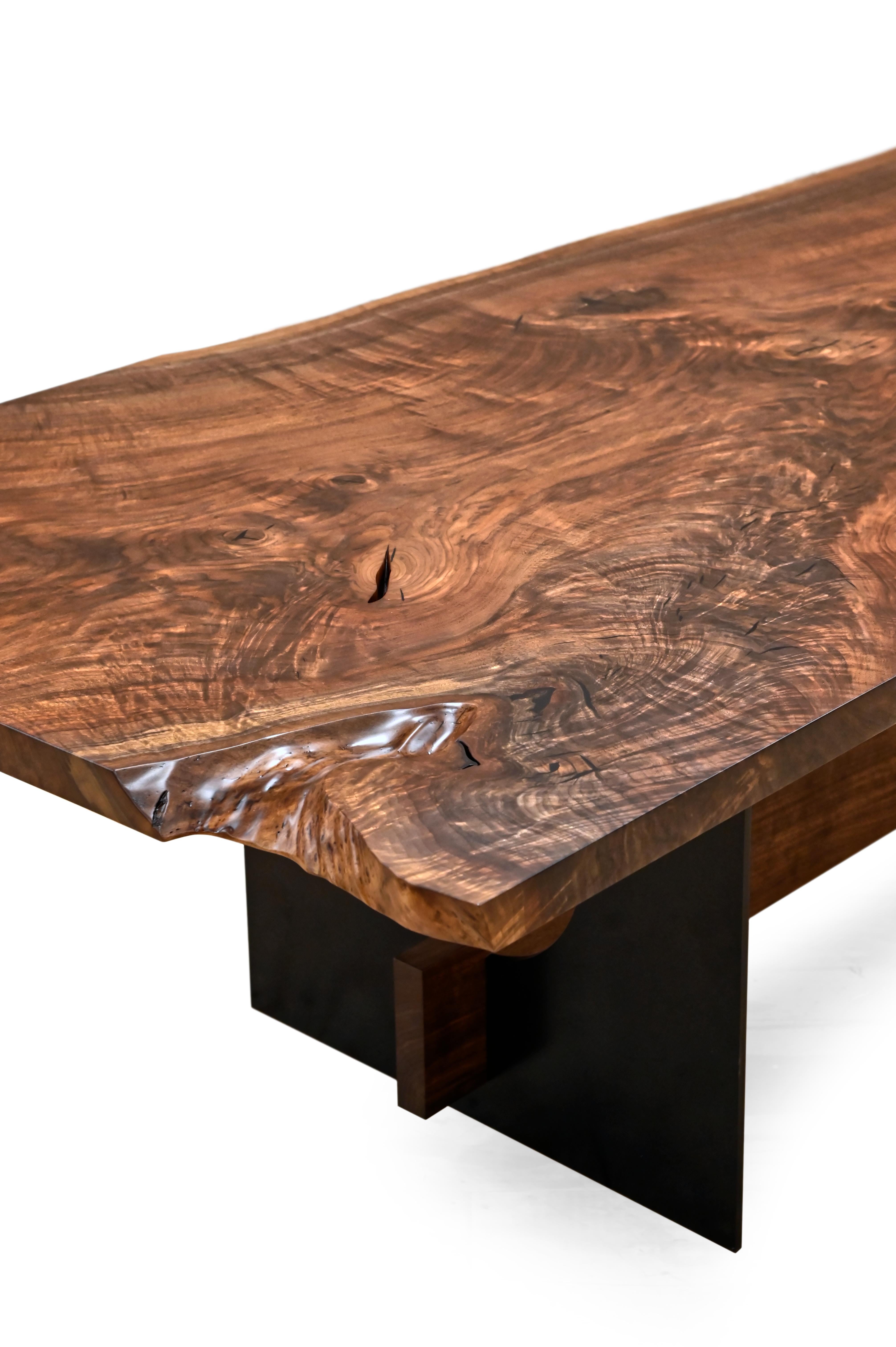 Industrial and Refined; these two words properly describe the Waubonsia Table. With a top of beautiful Walnut resting upon an pair of solid steel legs, this simple design fits well in any space from the most contemporary to the most rustic. 

The