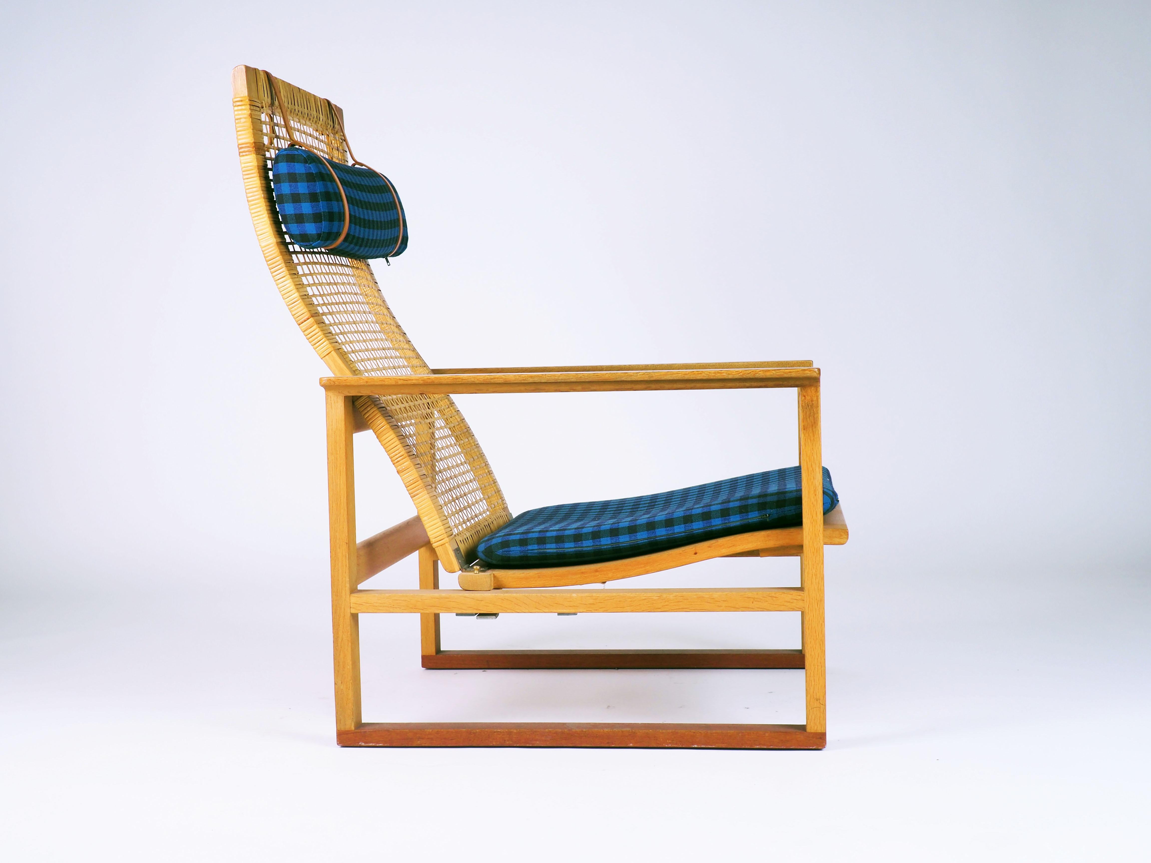 Rare easy chair designed 1957 by Børge Mogensen for Fredericia Stolefabrik. Made in solid oak and cane. Cushions with original fabric in very good condition.