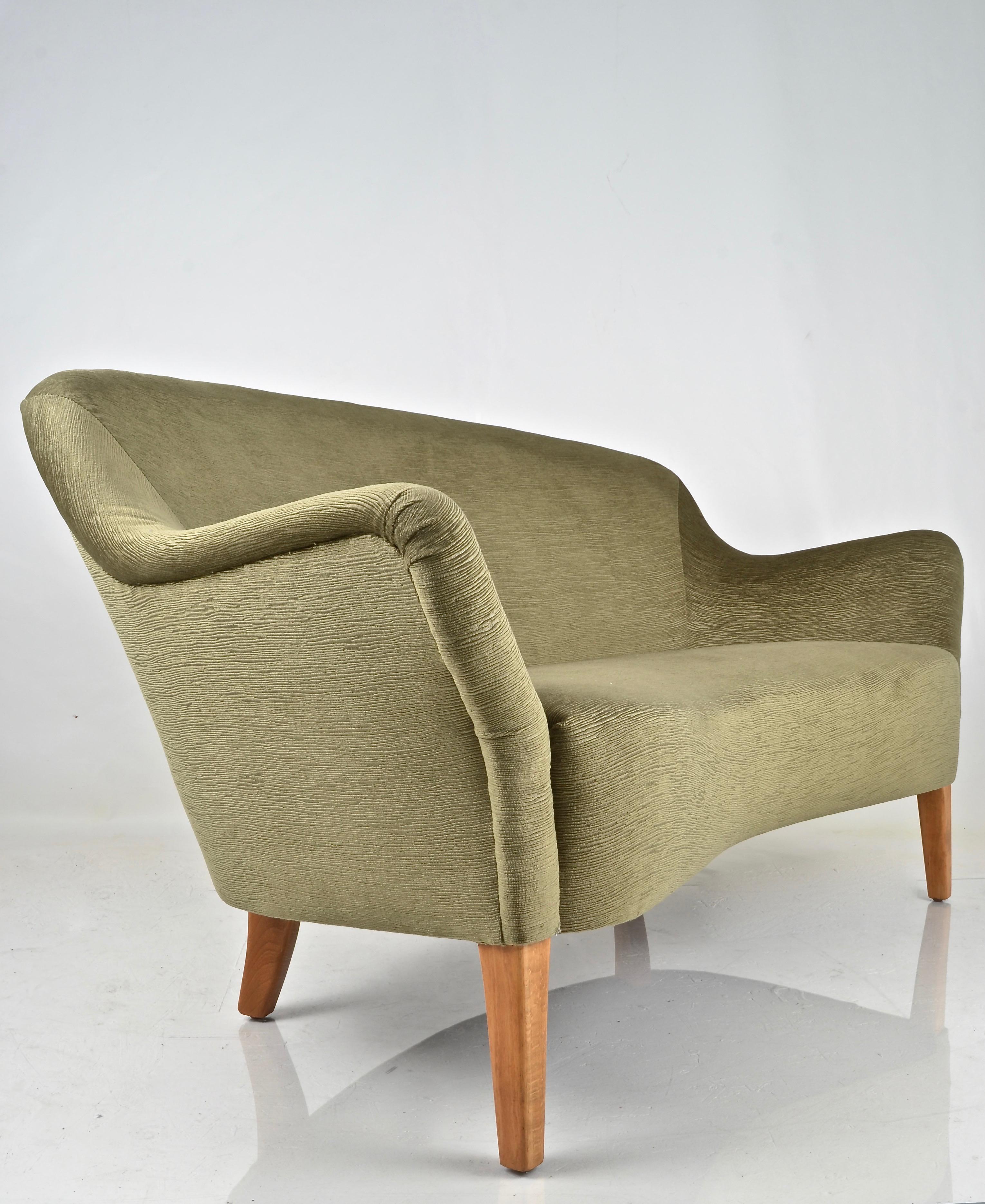 Great form and quality construction in this curvy, modern loveseat. Note kidney shaped seat. Newly upholstered in a stripy cut-velvet in mossy green. Tight back and seat. A nice example of early Scandinavian Modern Design.