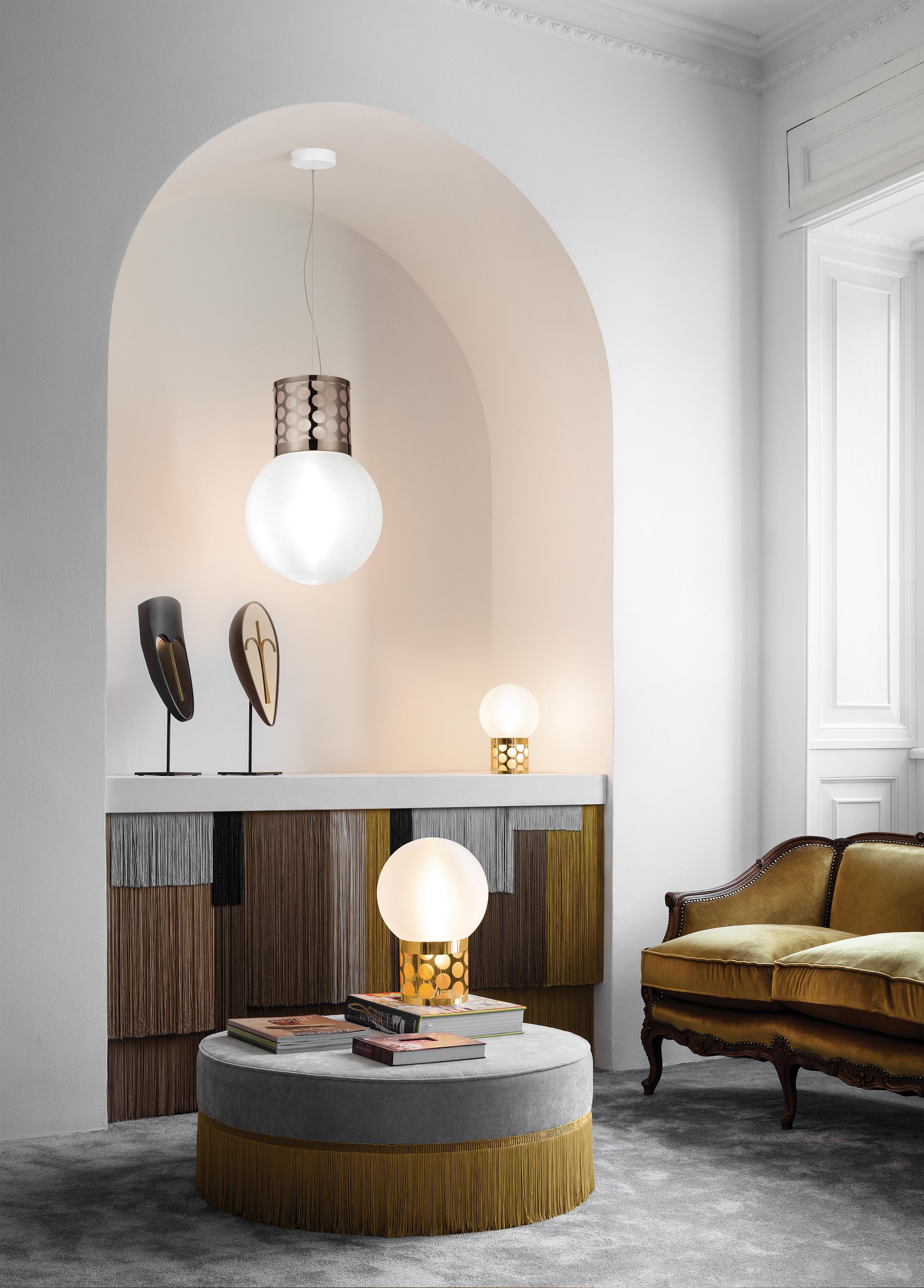 Atmosfera lies at the apex of fashion and design, where light melds into fabric. The new collection of table lamps are available in 2 sizes, and displays superimposed techno polymer layers create a polkadot effect. The lamps have independent