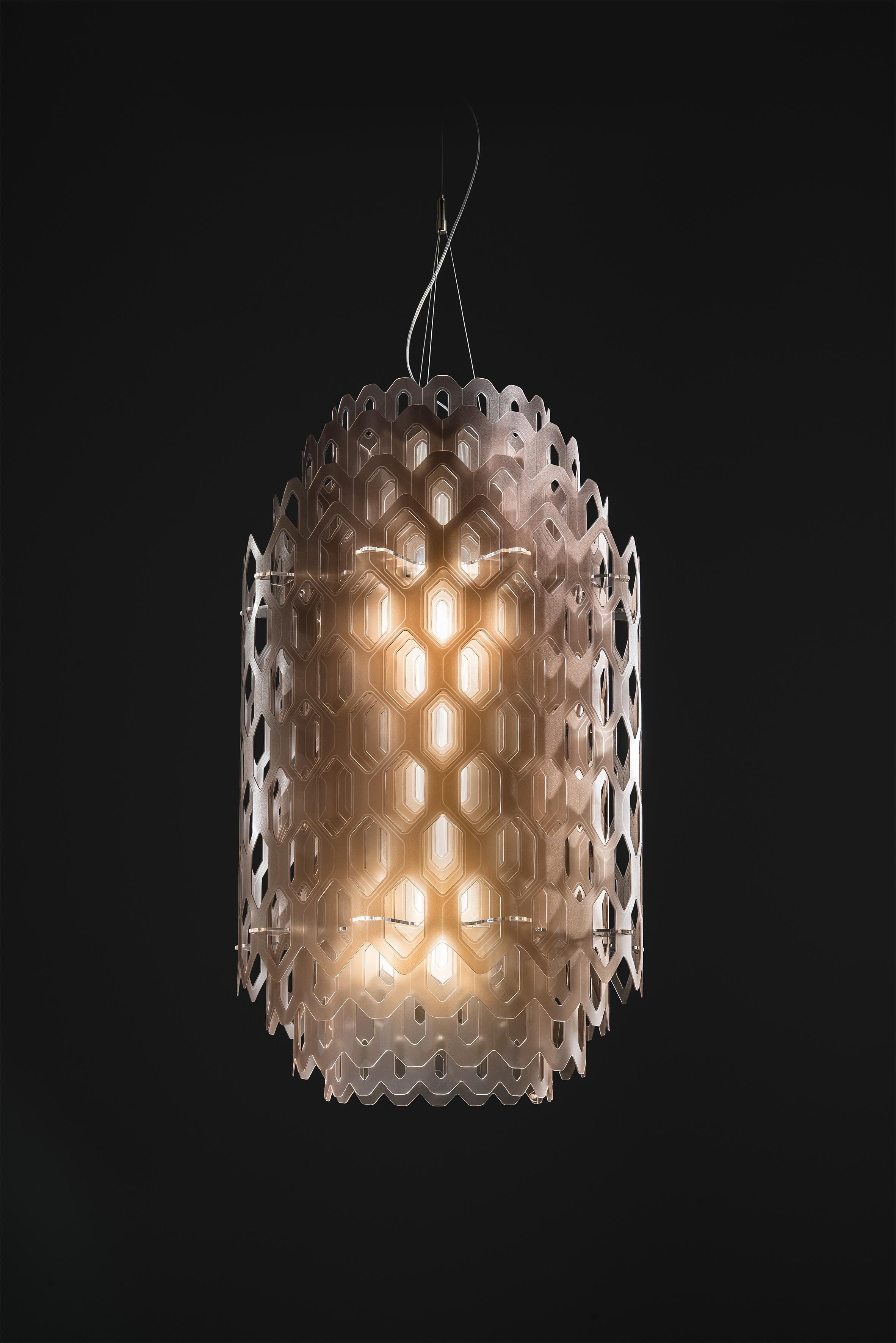 Chantal’s sculptural shape seems to be molded from a singular, industrious frame, much like honeycomb with its impalpable elements. Its concentric, hexagonal shapes allow for unending views. Chatal’s LED source resembles waves pulling away from the