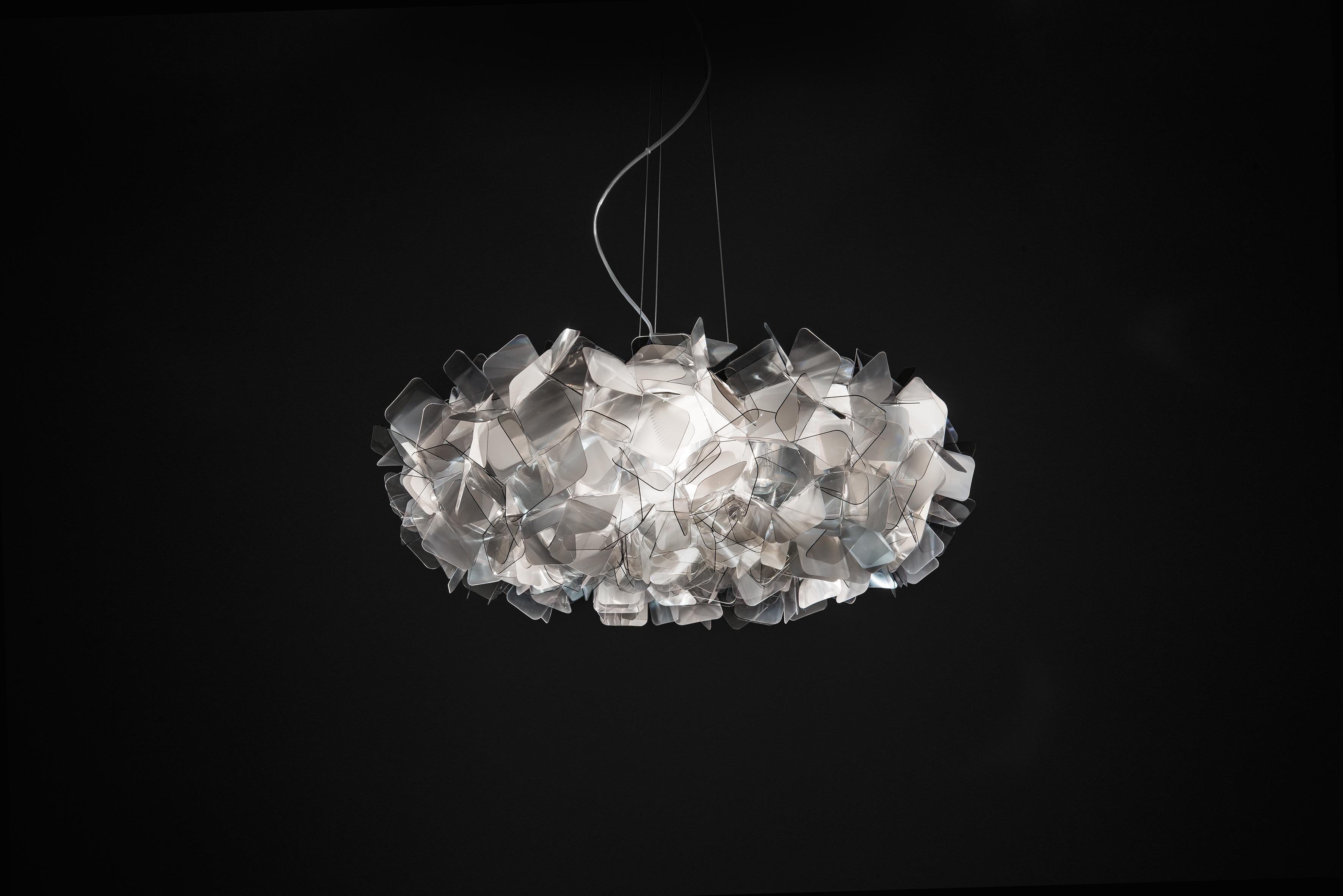 Clizia is a series of shapes fit together to create a perfect balance of reflections and transparencies. The lamp has taken note of natural forms, resembling a cloud that captures the first changing rays of morning sun, or a treetop filtering a play