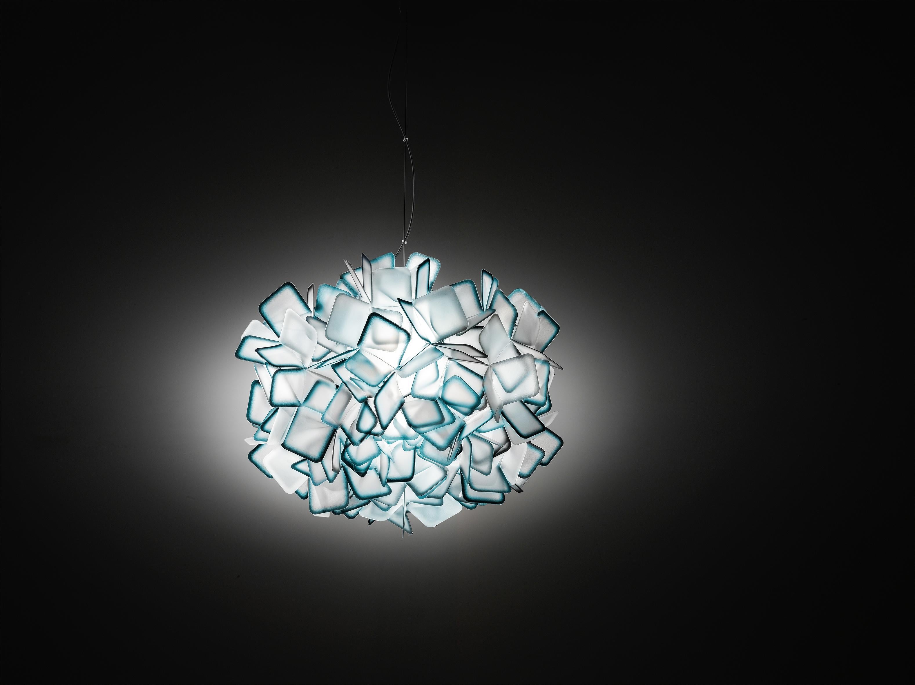Clizia is a series of shapes fit together to create a perfect balance of reflections and transparencies. The lamp has taken note of natural forms, resembling a cloud that captures the first changing rays of morning sun, or a treetop filtering a play
