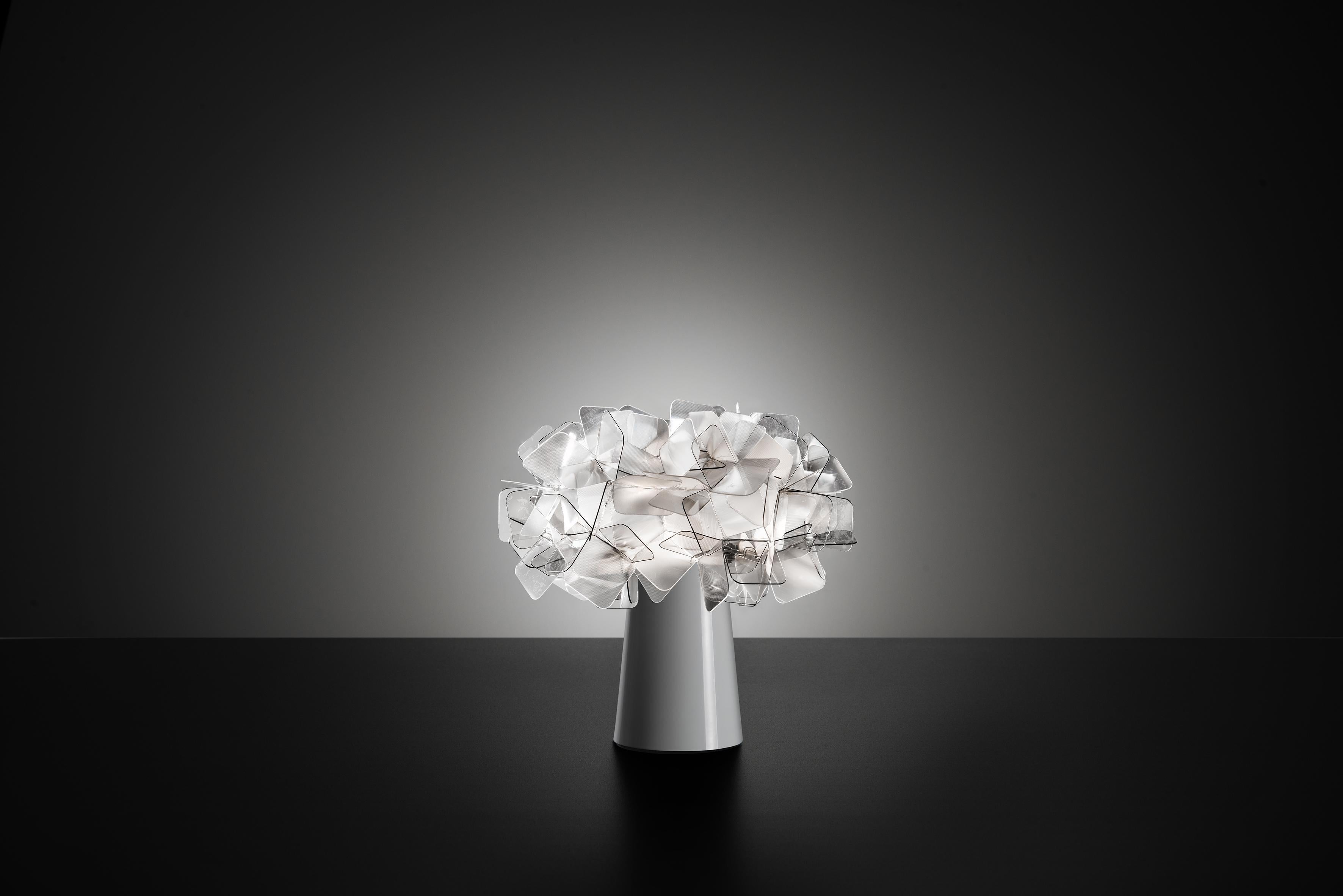 Clizia is a series of shapes fit together to create a perfect balance of reflections and transparencies. The lamp has taken note of natural forms, resembling a cloud that captures the first changing rays of morning sun, or a treetop filtering a play