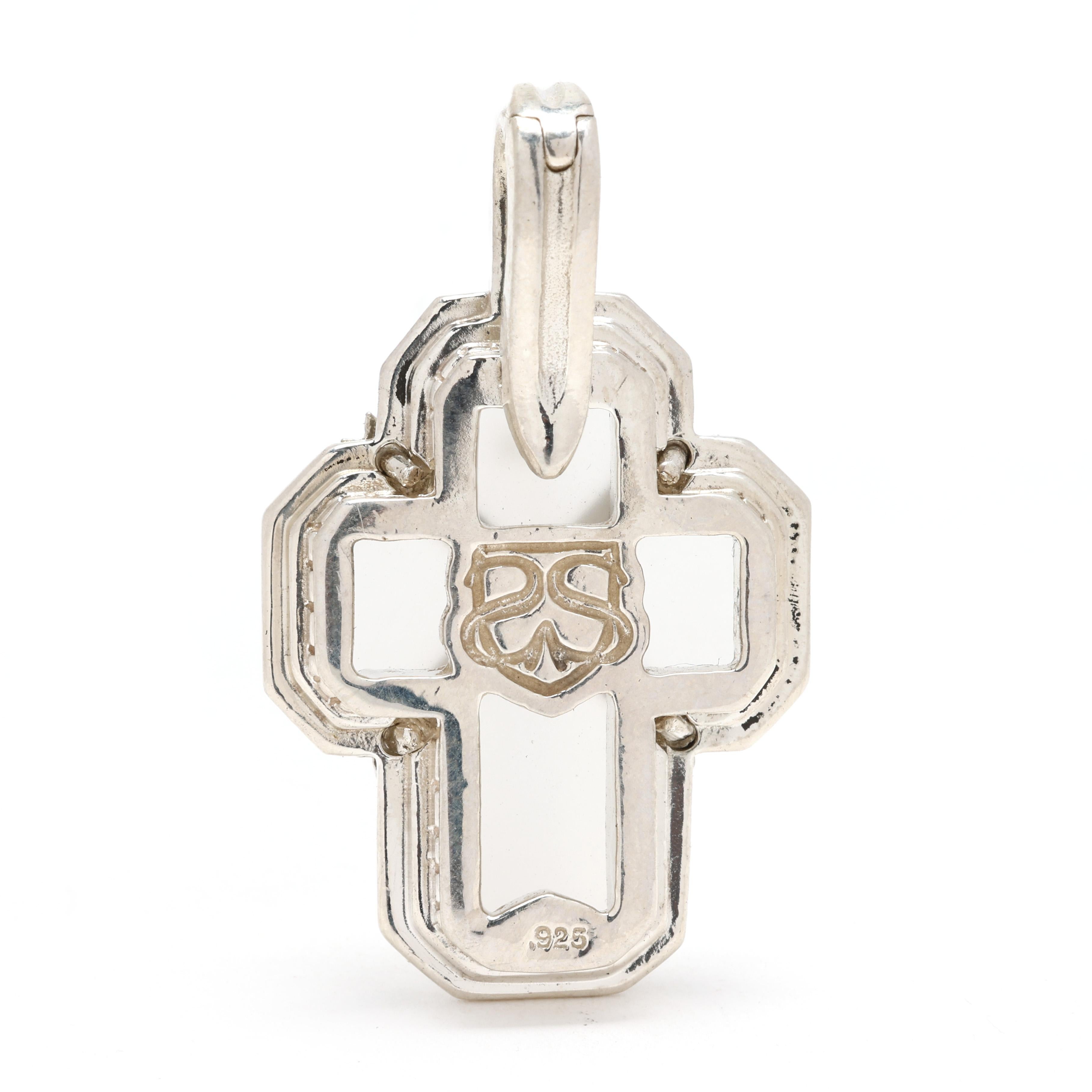 Elevate your collection with this stunning Slane & Slane frosted rock crystal cross pendant, crafted in sterling silver. Featuring a beautifully frosted rock crystal carved into an elegant cross design, this pendant embodies timeless spirituality