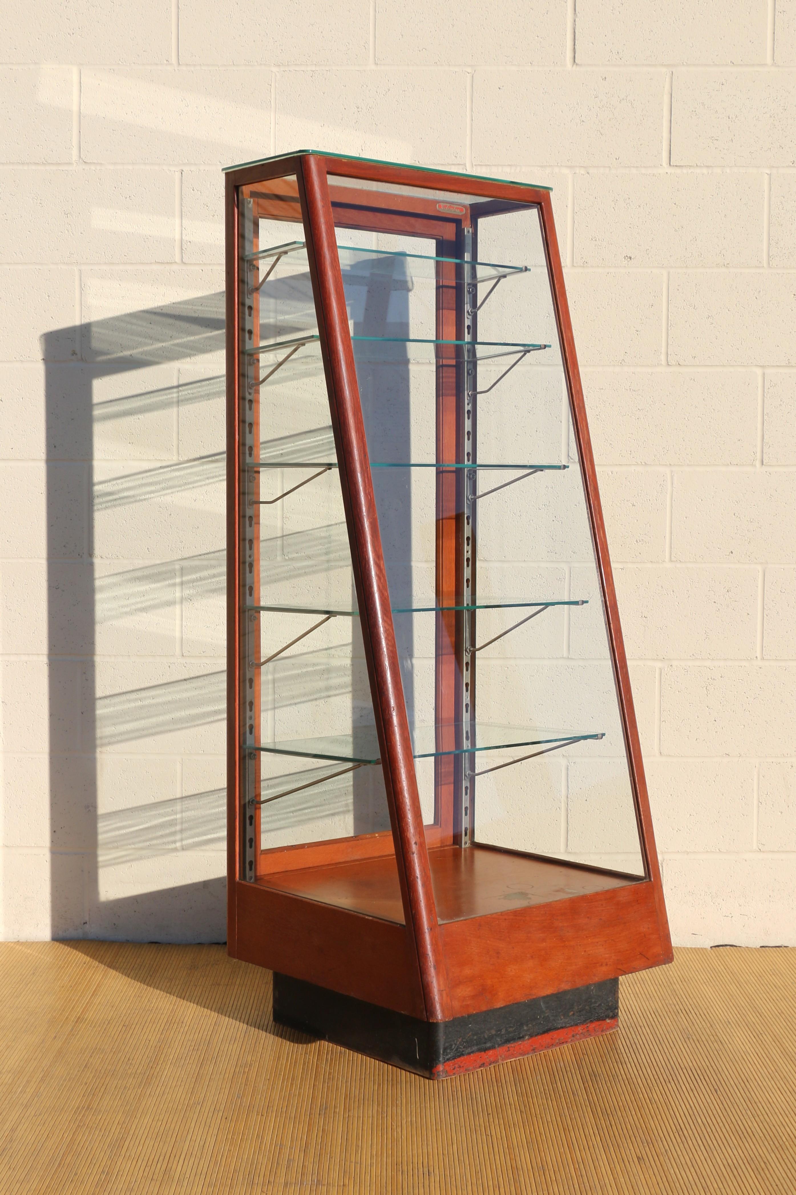 Wonderful slant front display case by THE COLUMBUS SHOW CASE COMPANY, COLUMBUS. O. In good vintage condition. It has five shelves and they are adjustable. One of them has a chip, shown in the pictures.
Dimensions: 
24in L” x 23in D” x 60.5in H”
24in