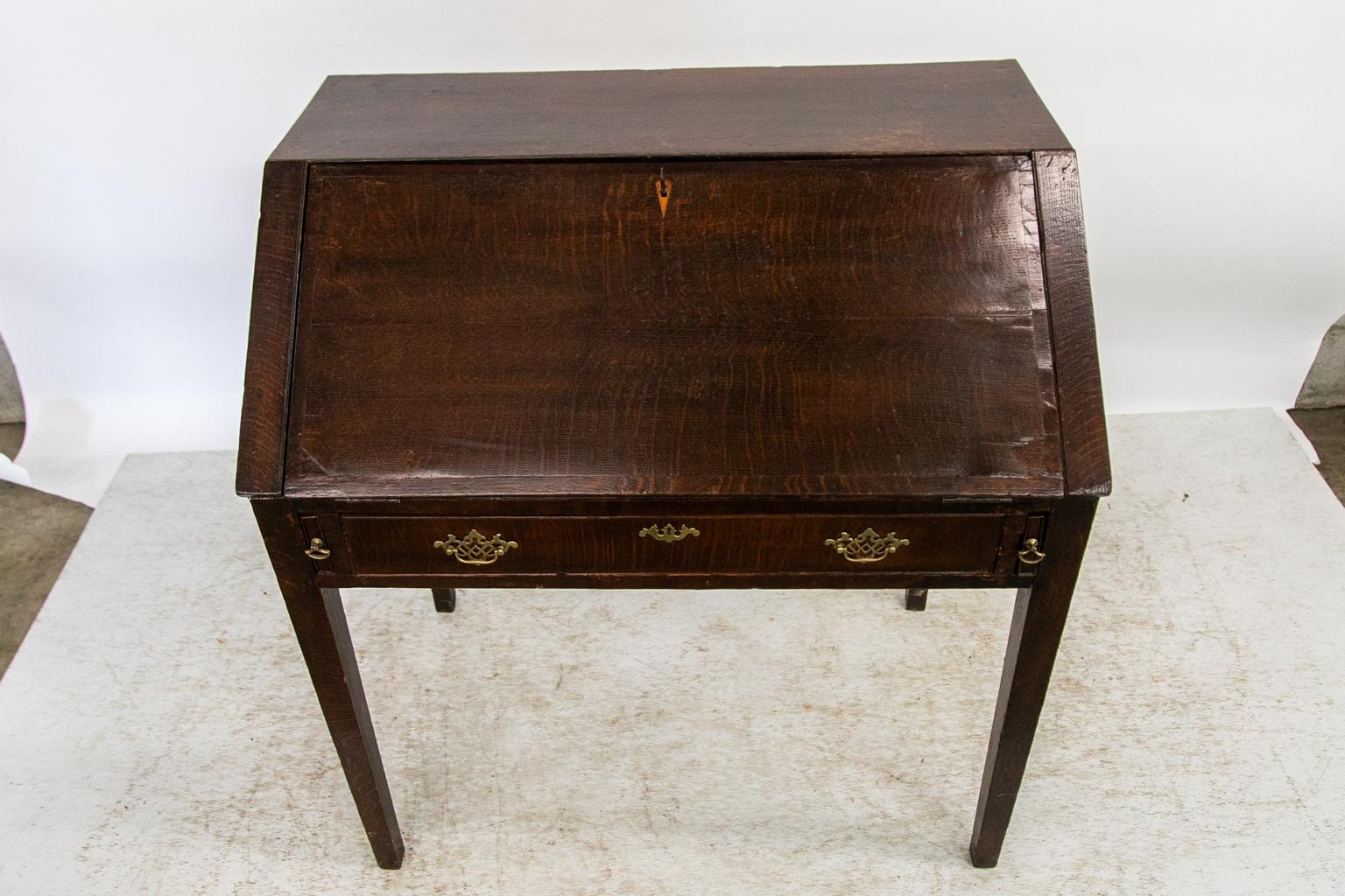 The leather writing surfaces on this desk have been newly restored with blind and gold tooling. The inside prospect door has a working lock and key.