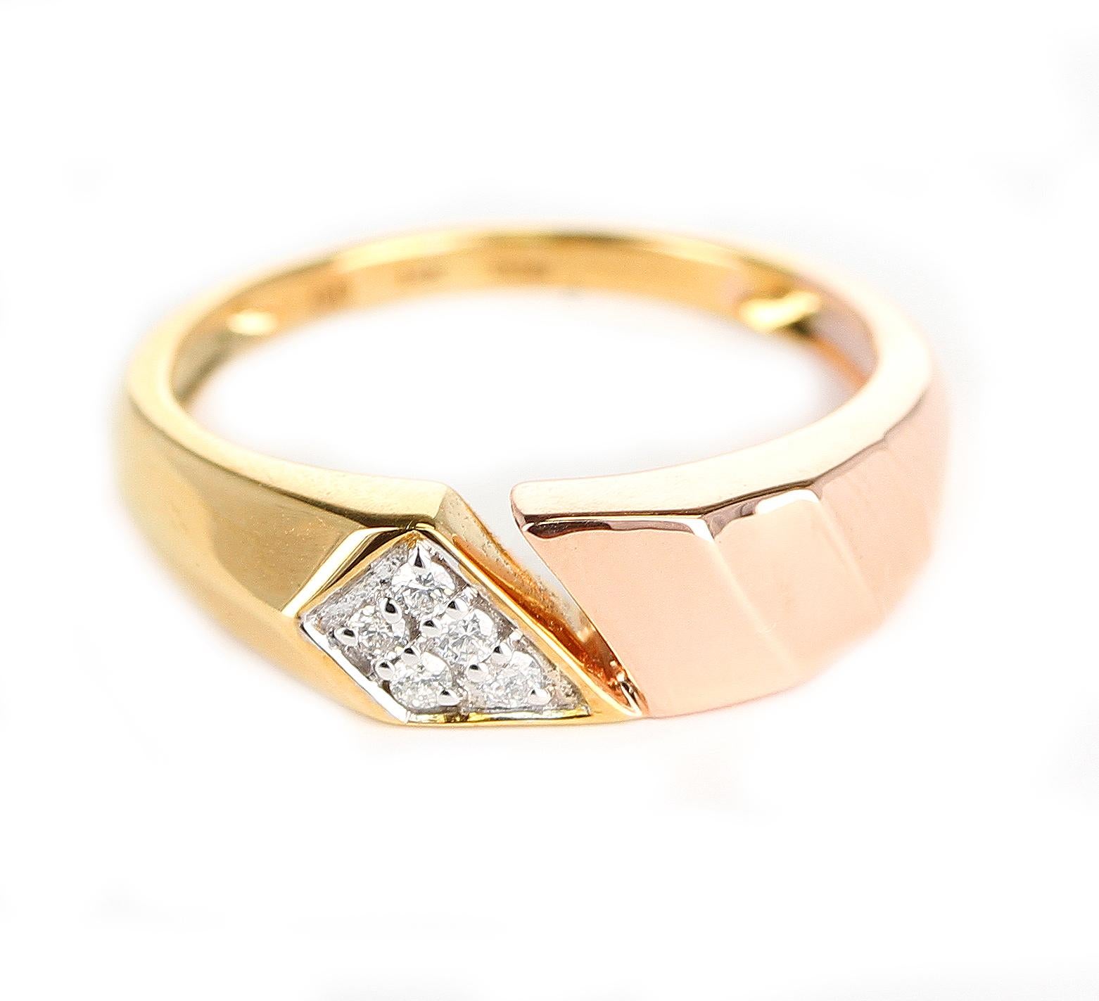 A trendy and every-day wear ring with a slanted design of 14K Yellow and Rose Gold and Diamonds. Diamond Weight: 0.08 cts. Ring size: 6. Signed D'D for D'Deco Jewels.