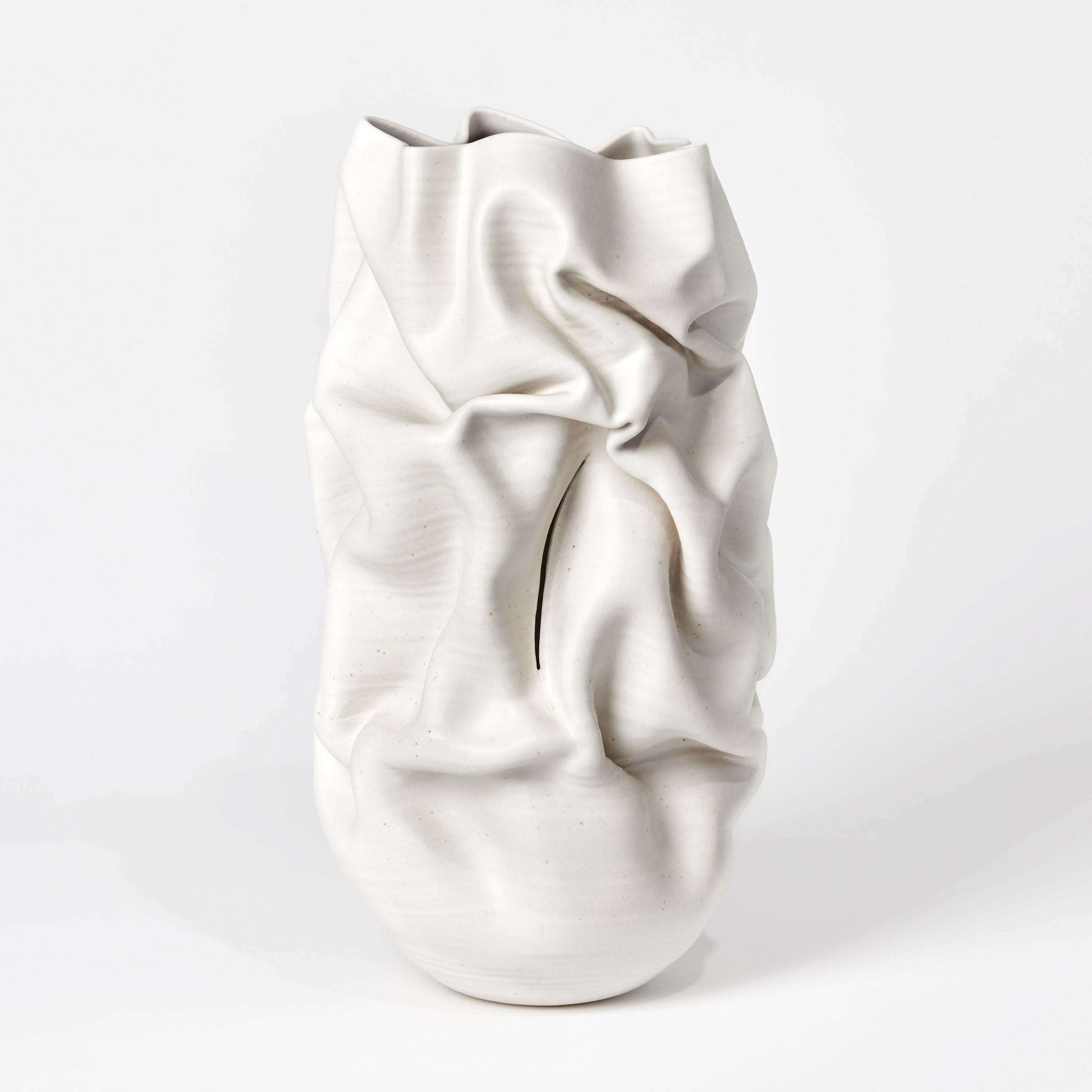 Slashed Crumpled Form No 60 is a unique ceramic sculptural vessel by the British artist Nicholas Arroyave-Portela, made from white St.Thomas clay with stoneware glazes.

Nicholas Arroyave-Portela’s professional ceramic practice began in 1994.