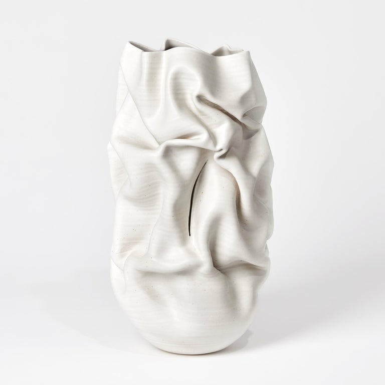 Slashed Crumpled Form No 60 is a unique ceramic sculptural vessel by the British artist Nicholas Arroyave-Portela, made from white St.Thomas clay with stoneware glazes.

Nicholas Arroyave-Portela’s professional ceramic practice began in 1994.