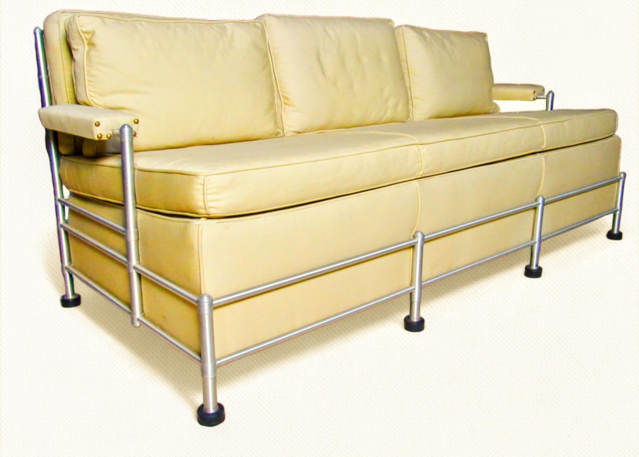 A slat back three-seat sofa, an early design by Warren McArthur manufactured in Rome, New York in 1933-1934. 
The slat back seating of Warren McArthur is his first seating design introduced in his earliest line of furniture production in Los Angeles
