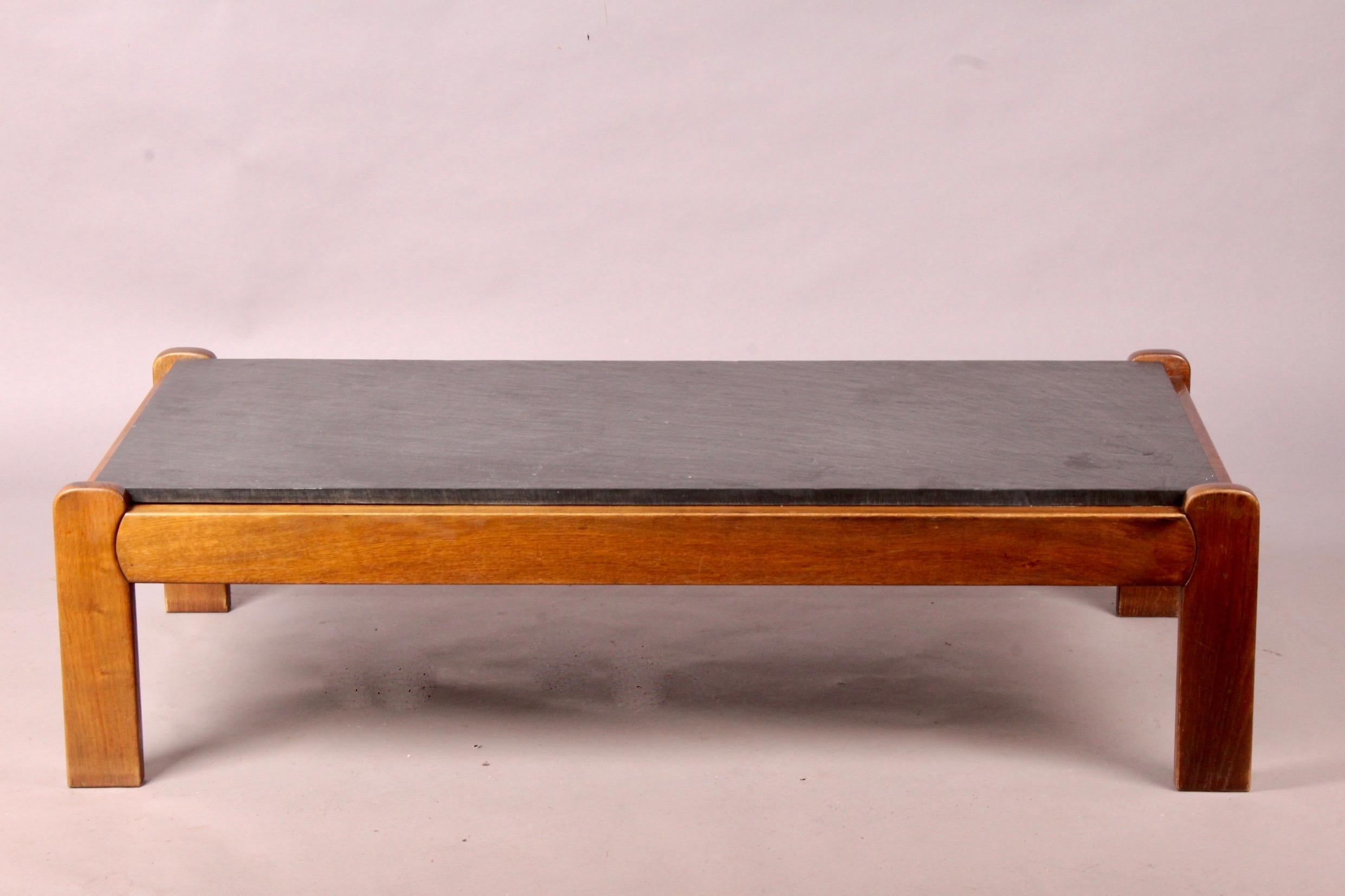 Slate and wood rectangular coffee table.