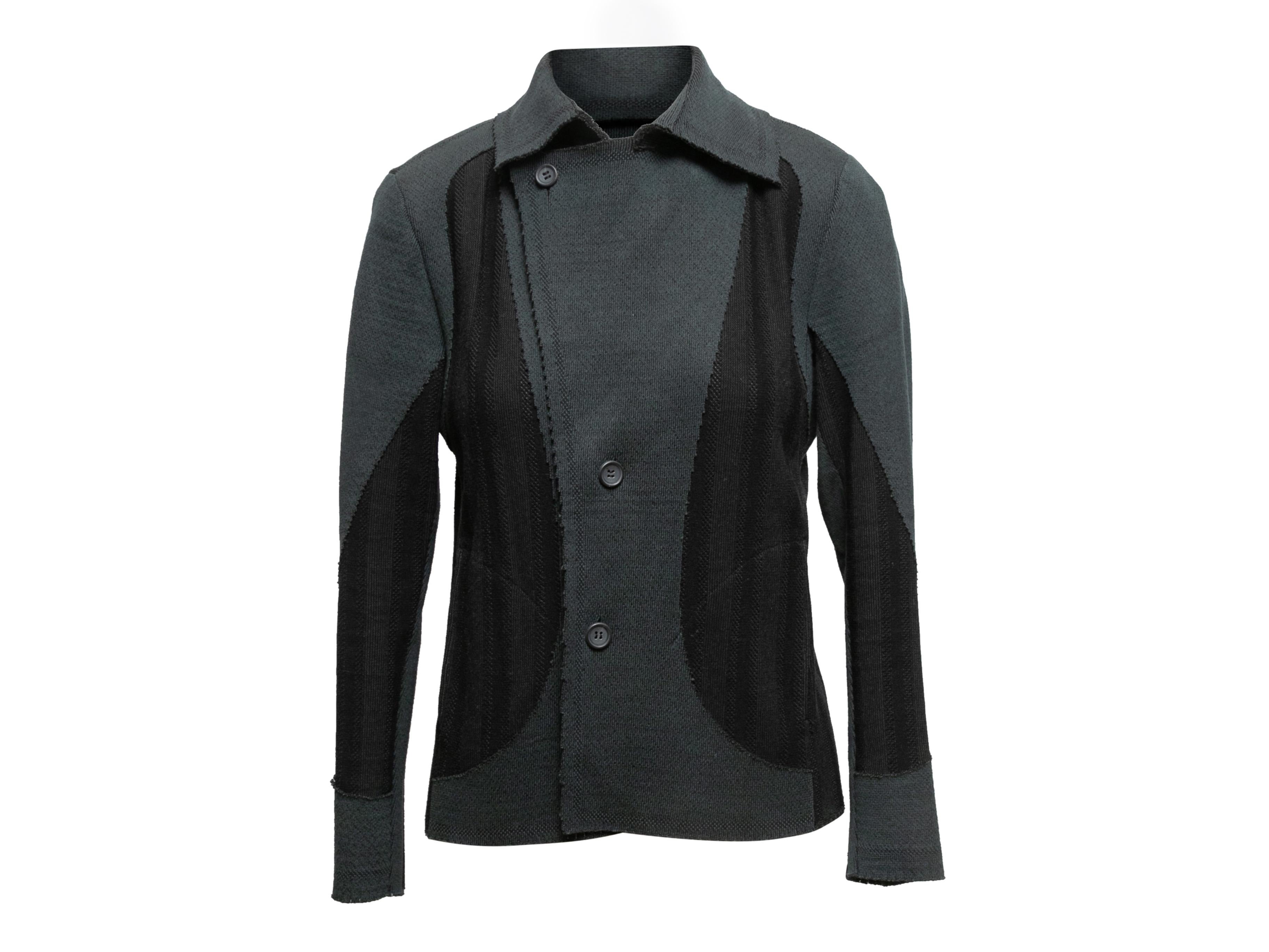 Slate and black knit jacket by Issey Miyake. Notched lapel. Button closures at front. 40