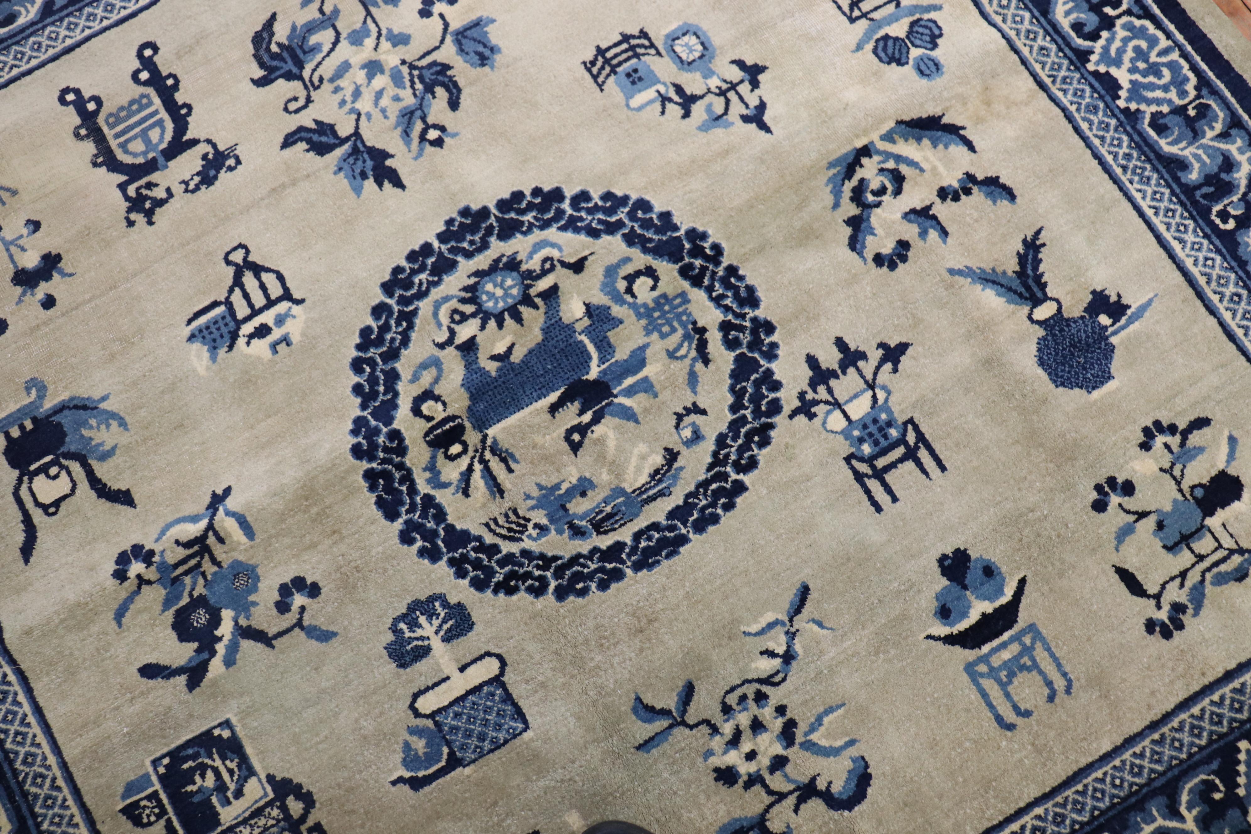 A rare 6 foot square an early 20th century Chinese rug with a graphic Chinese Motif in slate and blue

Measures: 6' x 6'1