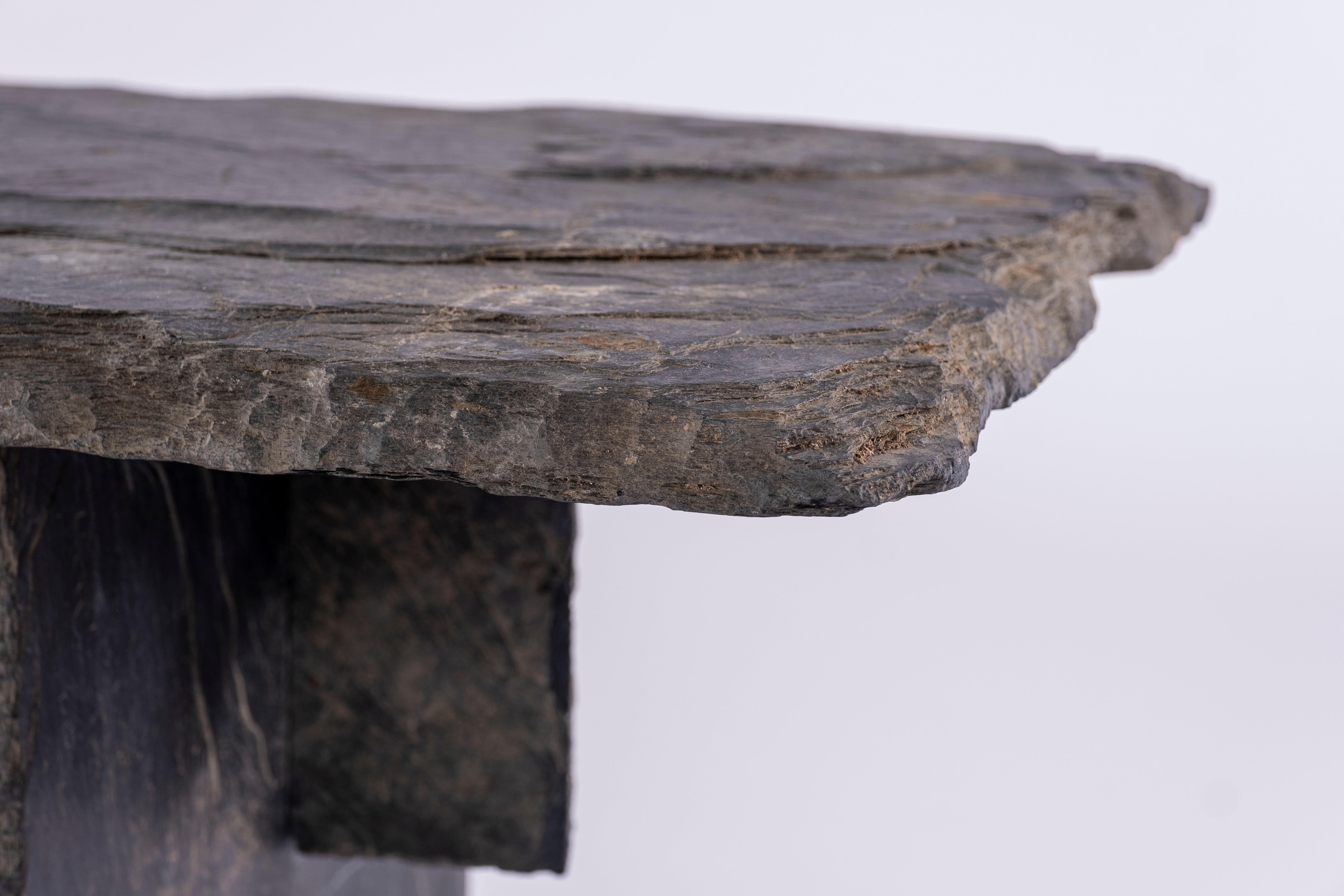 Slate coffee table with rustic edges.