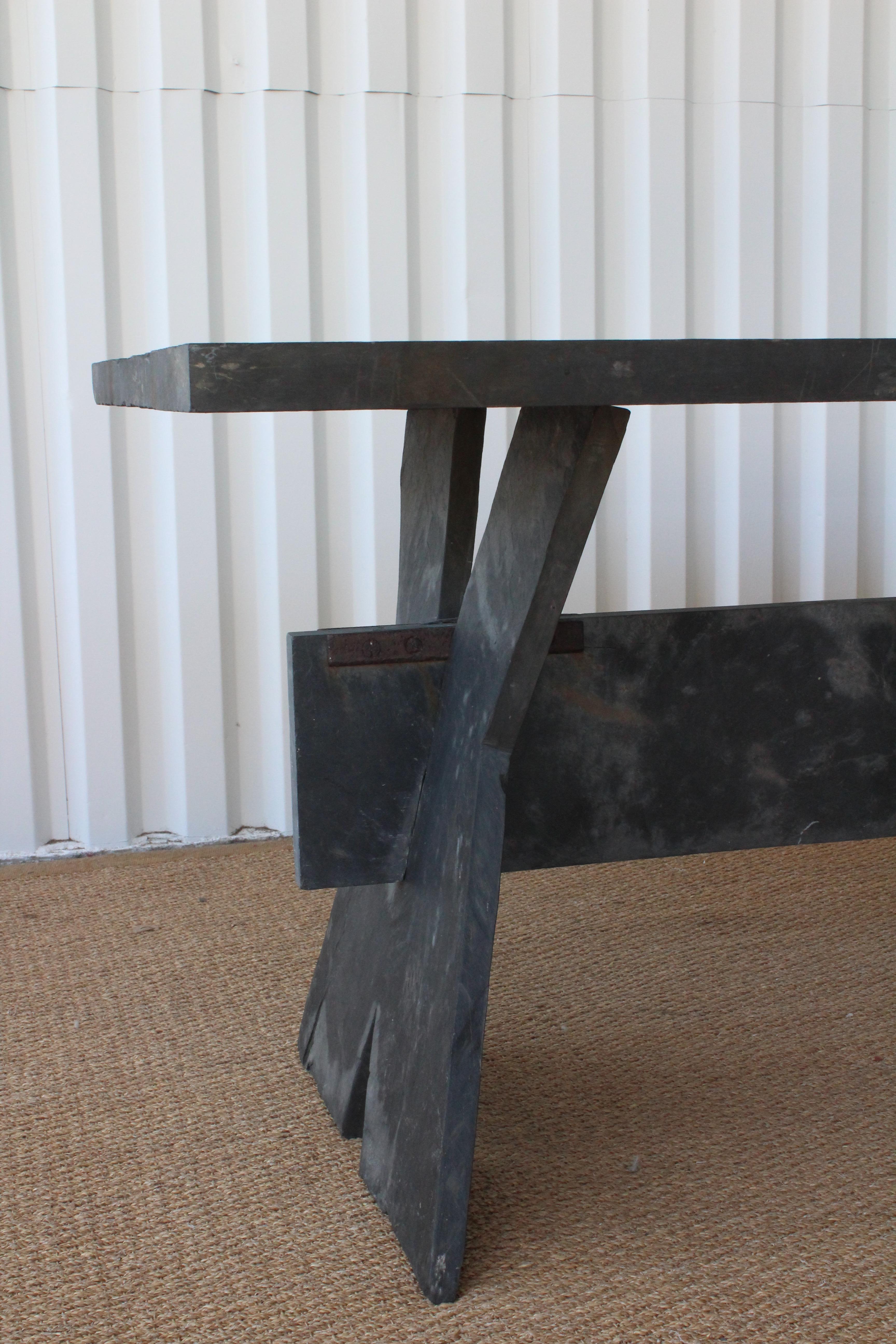 1950s French slate dining table. Age appropriate wear. Base comes apart in three pieces. Suitable or indoor and outdoor use.
