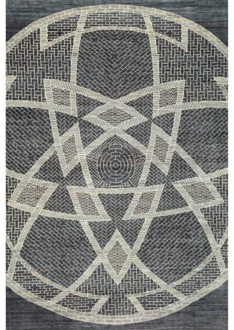 This slate gray, square Persian carpet created by Orley Shabahang in pure wool measures 8' x 8.'  In Farsi, 