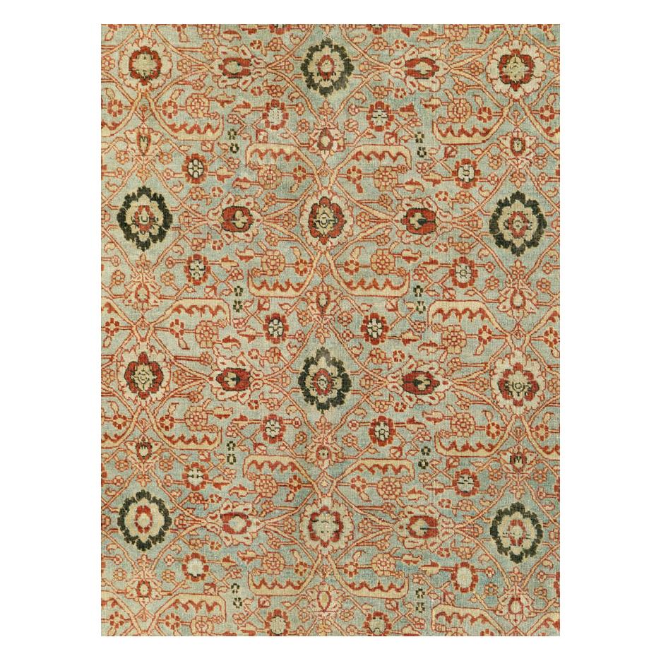 An antique Persian Tabriz room size carpet handmade during the early 20th century with a Kurdish style 'Herati' allover design over a grey field with a rust red border.

Measures: 8' 2