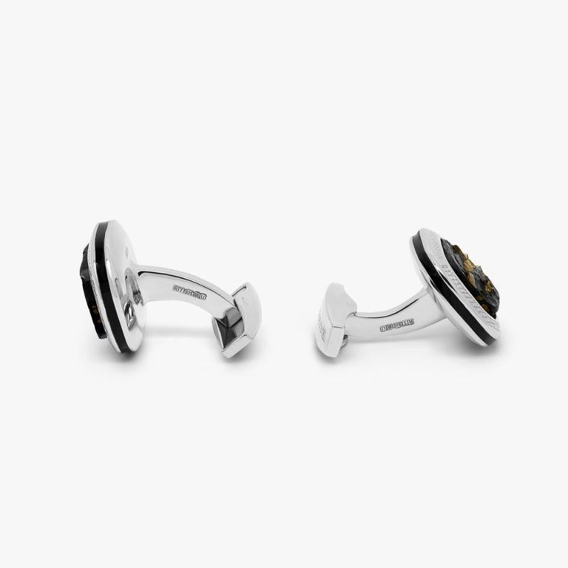 Slate Pyrite Cufflinks in Sterling Silver

This naturally occurring stone features small pieces of pyrite encased in slate which has been cut by a skilled lapidary in Idar Oberstein. This stone is commonly known as 'fool's gold' due to its