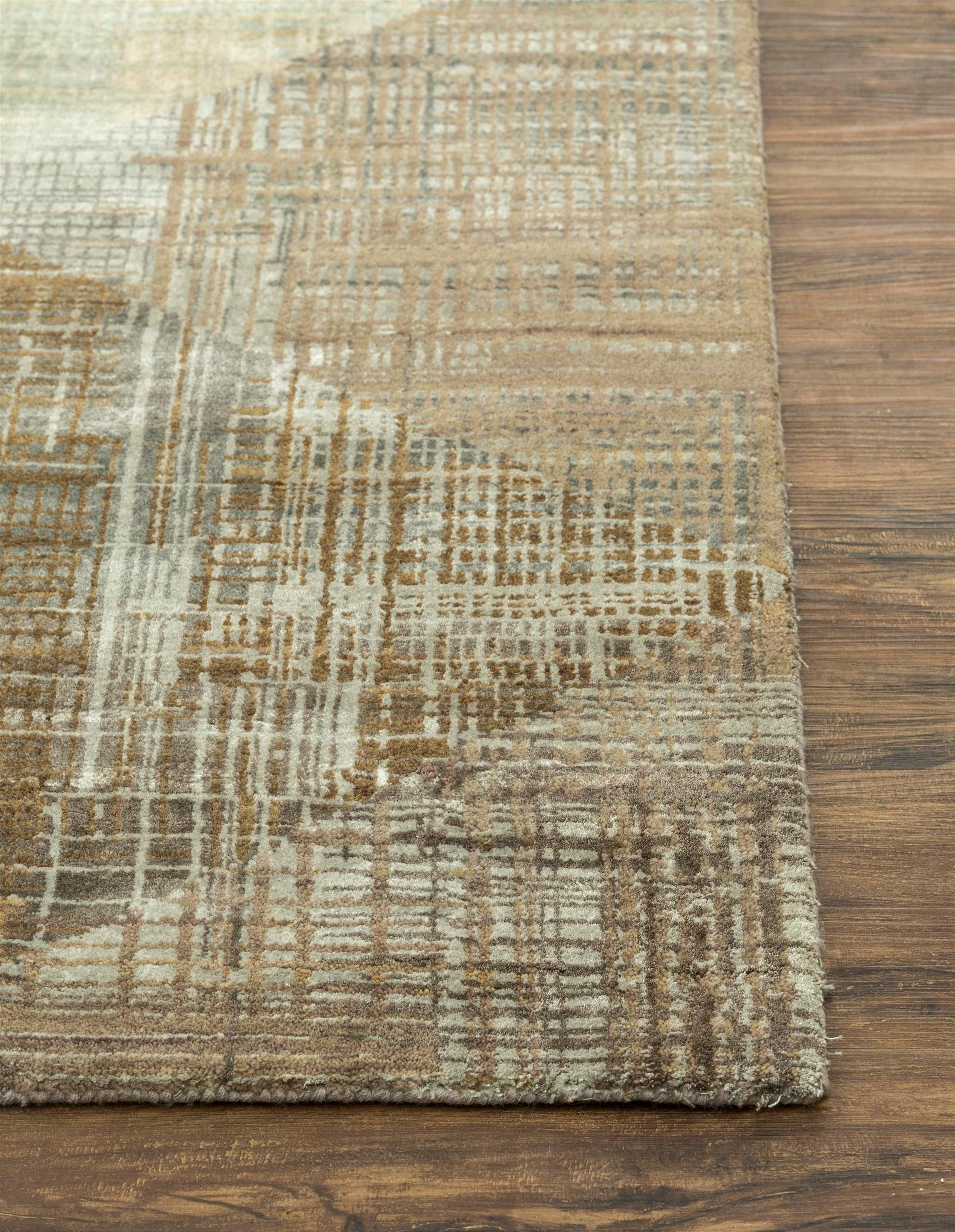 Embark on a design journey with the modern rug from the Unstring collection by Kavi, exclusively crafted . This hand-knotted rug, a blend of Wool and Bamboo Silk, resonates with rural Indian artistry. The classic grey ground color harmonizes