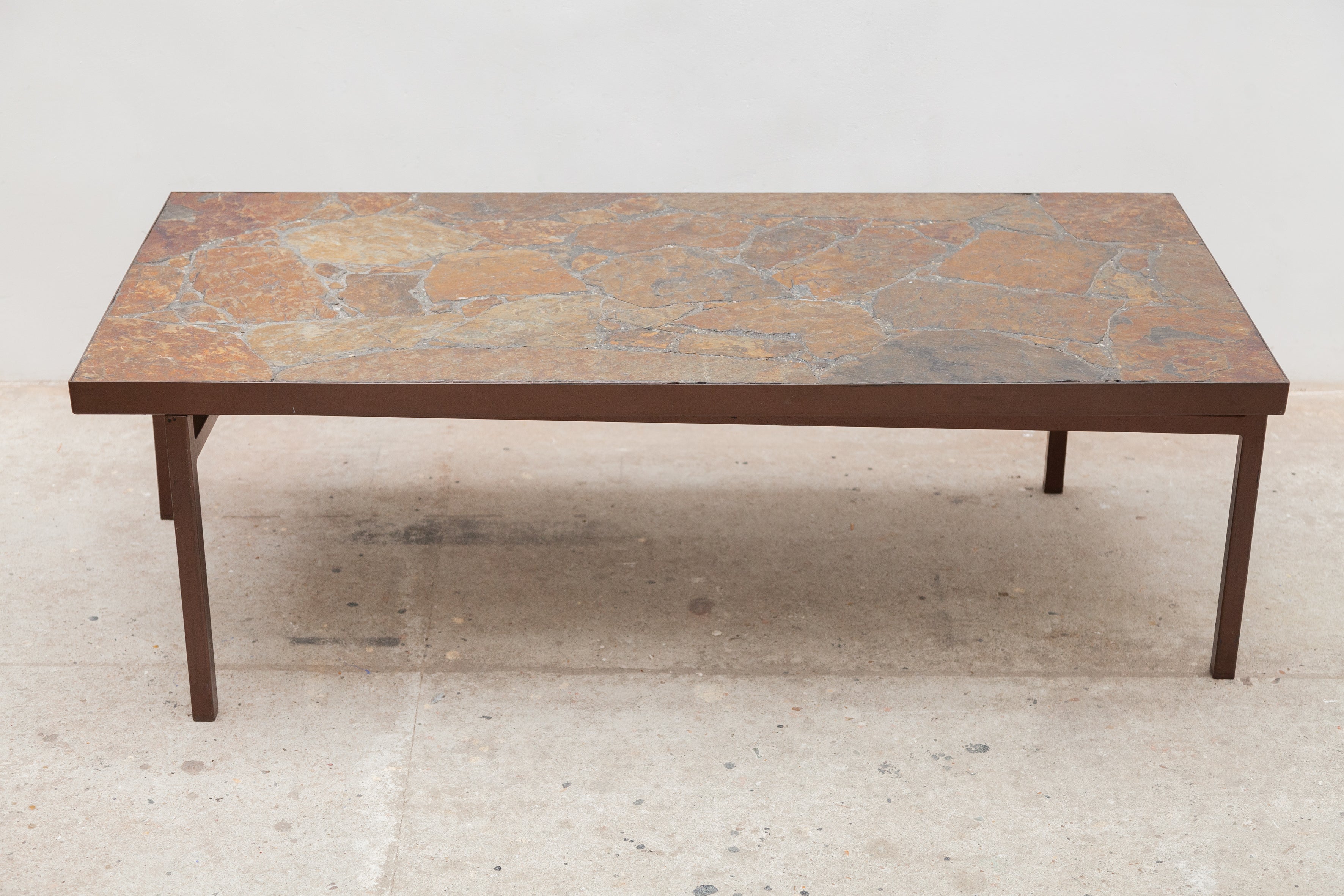 Mid-Century Modern coffee table. A slate stone brutalist coffee table designed in the 1960s. A 
