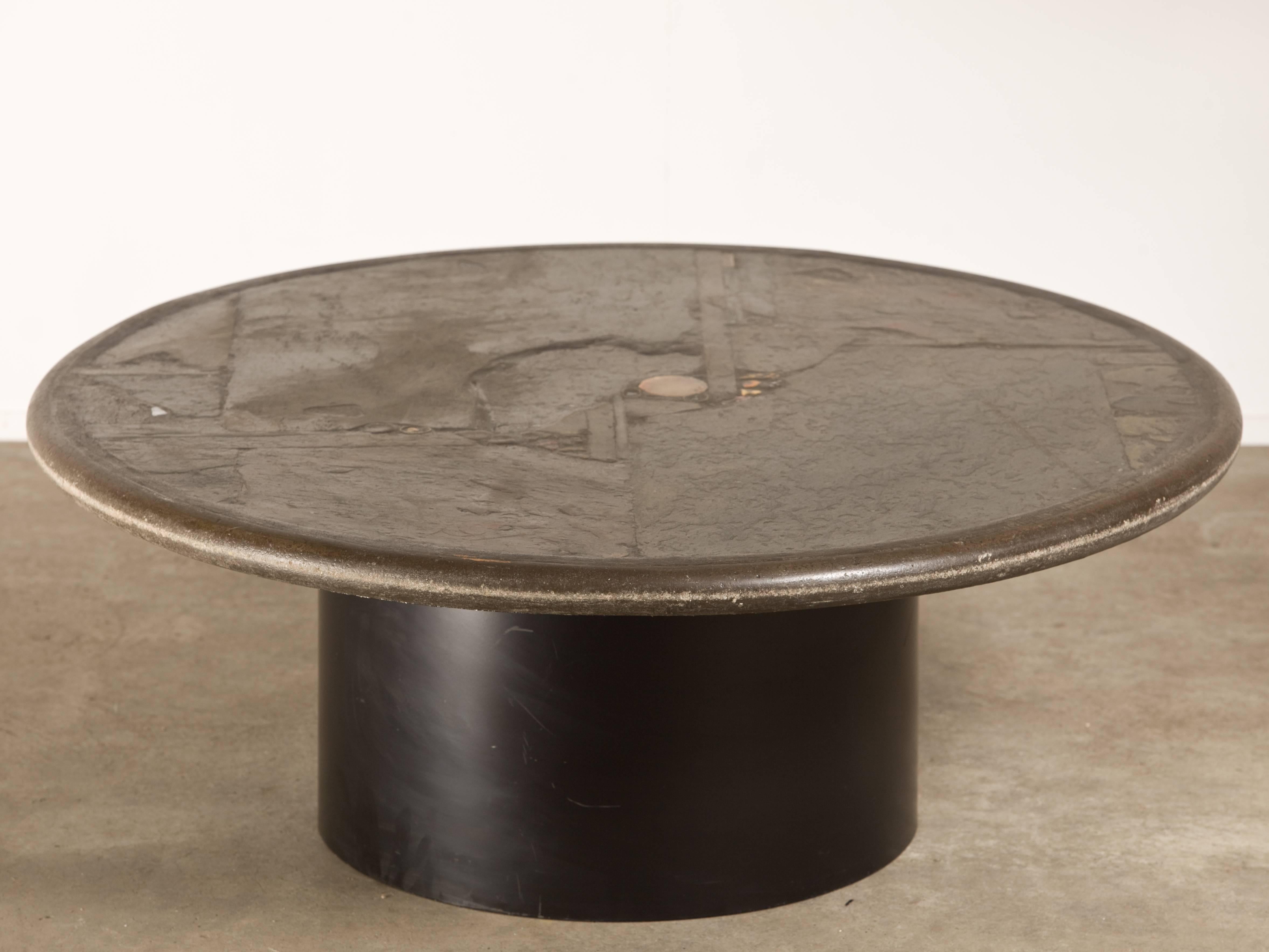 Beautiful dark colored slate stone Dutch design Brutalist style coffee table by Paul Kingma.
It has different shades of grey and amber yellow and blue-ish details. The table is signed in a copper inlay P. Kingma, 1989.