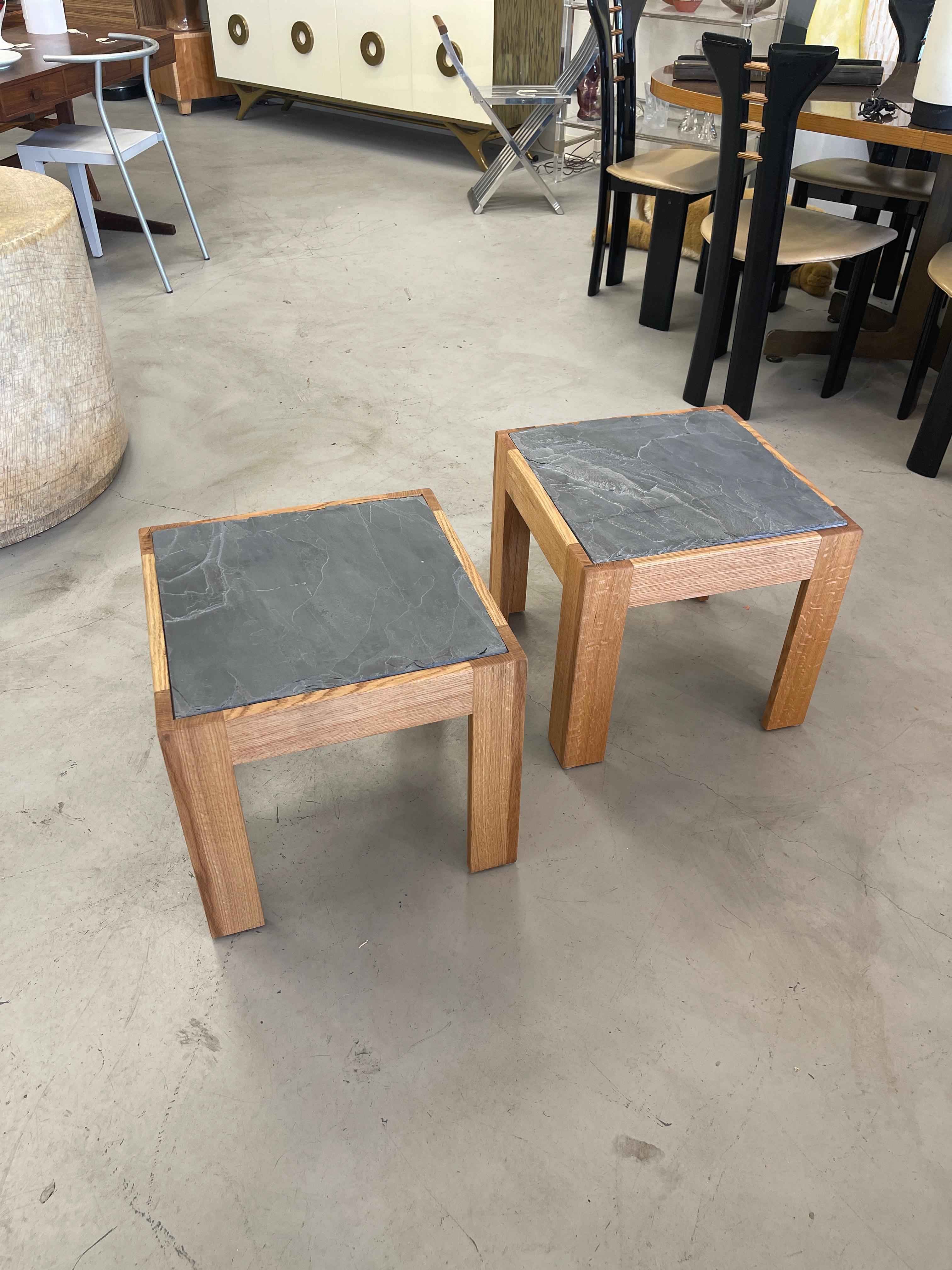 A pair of solid oak tables with slate inset tops. Beautiful graining to the oak sides. These are custom pieces newly made and ready to ship. The slate pieces have natural flaws, and imperfections, please see the detailed photos.
