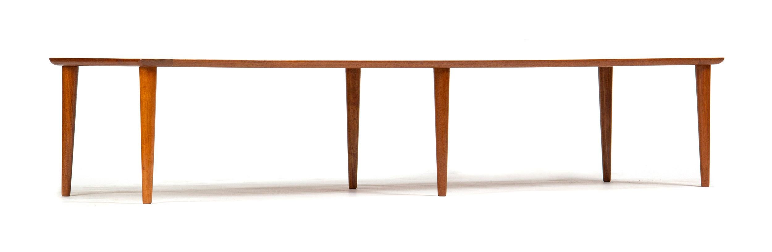 A Grete Jalk designed teak slat top bench with tapered dowel legs.

Working at a time when women were a rarity in the design world, Grete Juel Jalk completed her education at the Danish Royal Academy apprenticing under highly influential designer