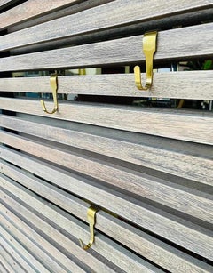 Slatted wood panel room divider or slatted coat rack with 10 mobile hooks