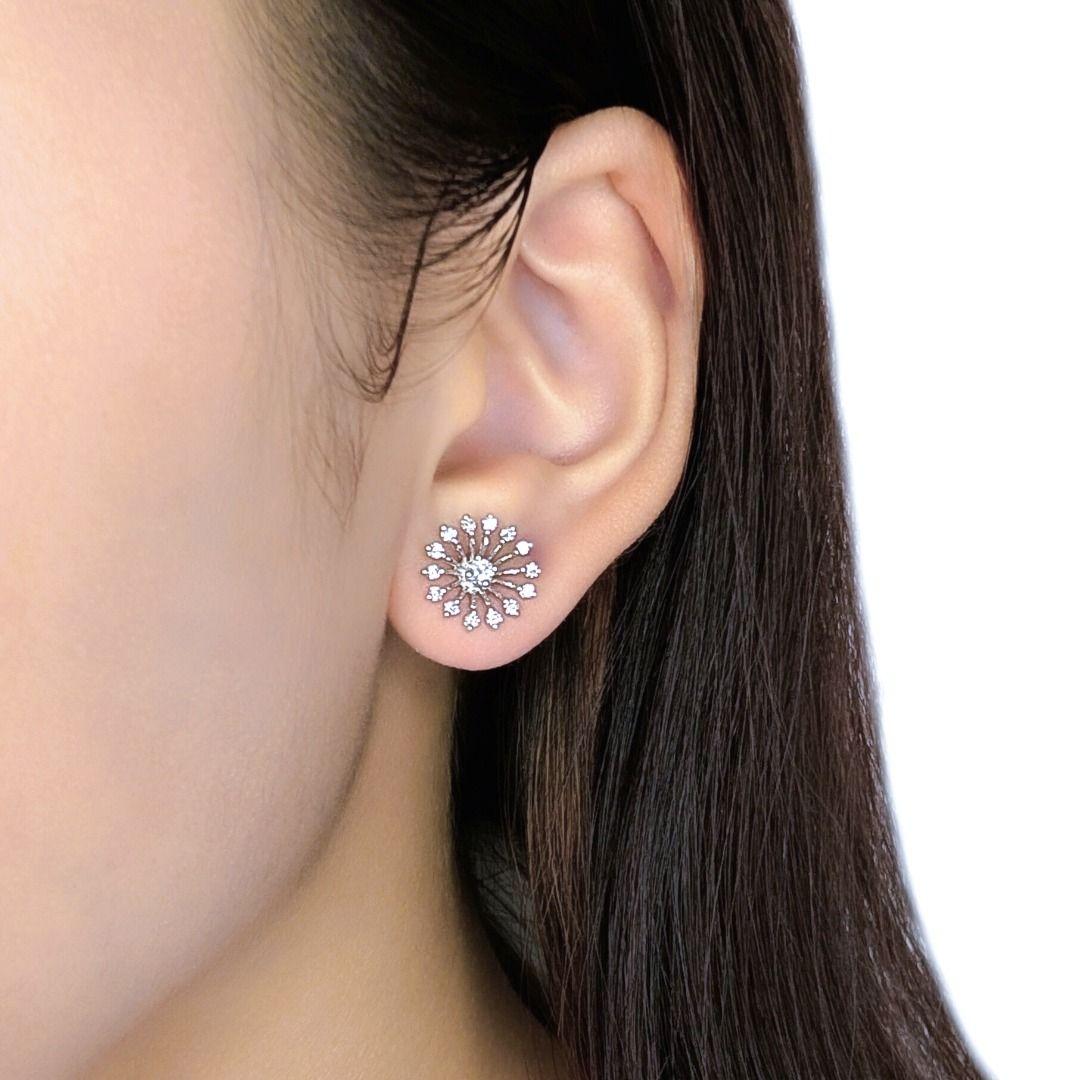 Elevate your everyday glamour with these stylish stud earrings, meticulously crafted in radiant 18K white gold. A dazzling array of thirty natural round brilliant diamonds, totaling a brilliant 0.64ct, creates an exceptional display of light and