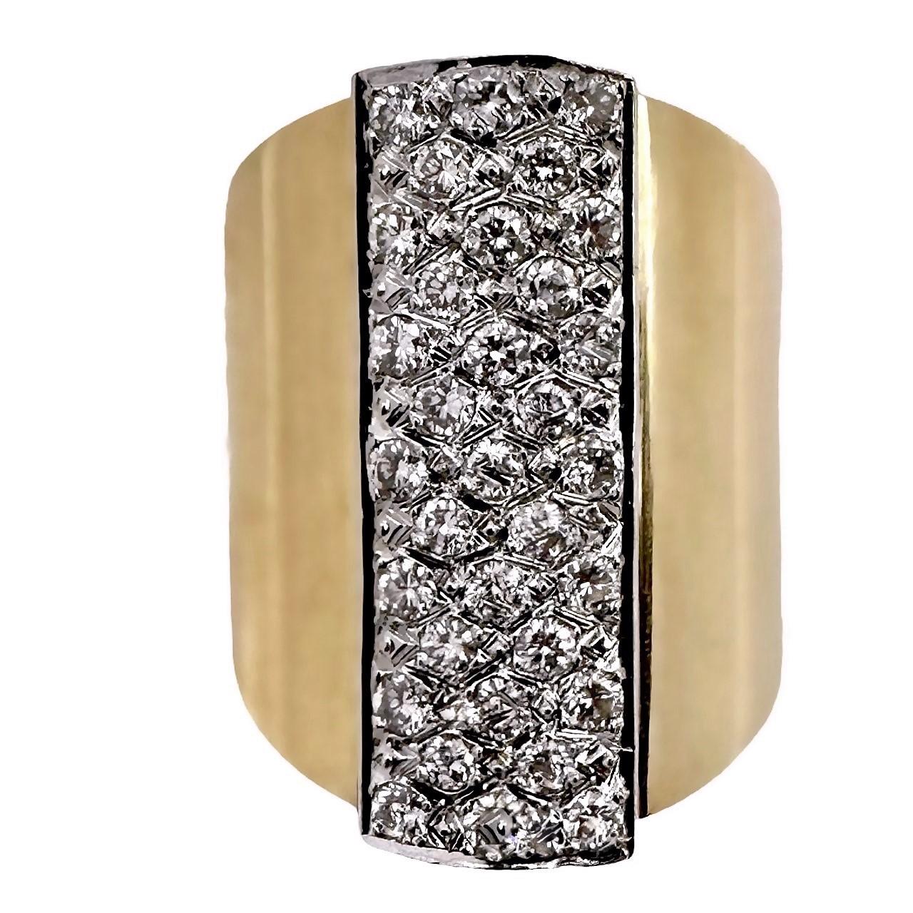This is a sleek, fashionable ring measuring one inch long on the finger, making it quite the statement piece. The smooth lines of the ring are accented by a 1 inch by 1/3 of an inch rectangular strip running down the center.  It is pave' set with 5