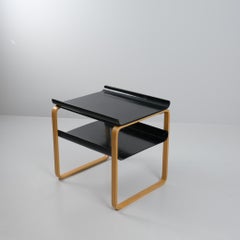 Elegante tavolino/rivista Alvar Aalto modello. 75, nero e betulla, Artek 1960