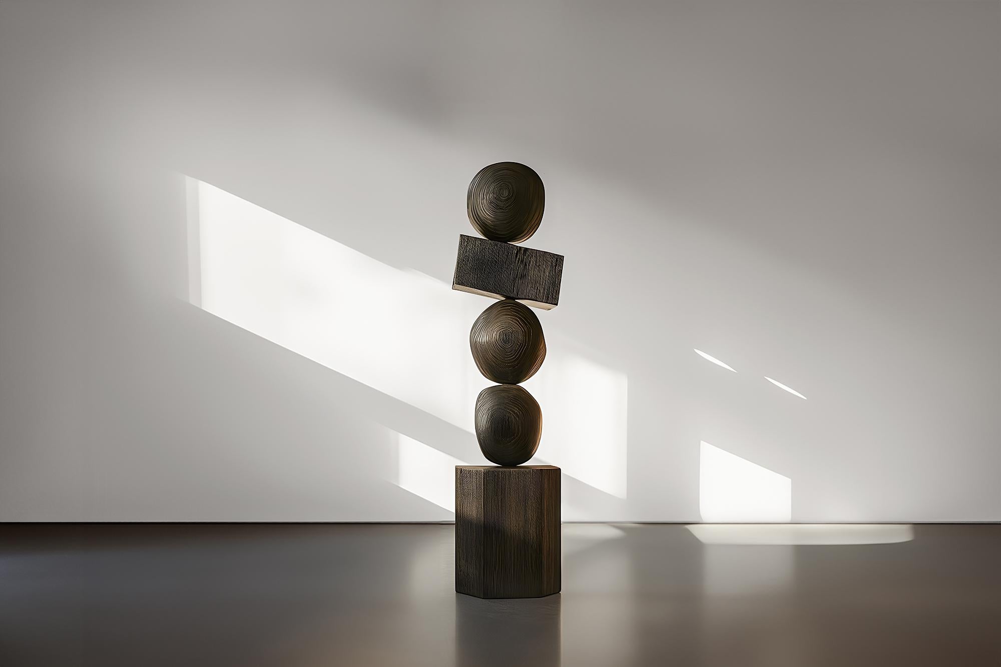 Sleek and Dark, Joel Escalona's Burned Oak Totem Emerges, Still Stand No92
——


Joel Escalona's wooden standing sculptures are objects of raw beauty and serene grace. Each one is a testament to the power of the material, with smooth curves that flow