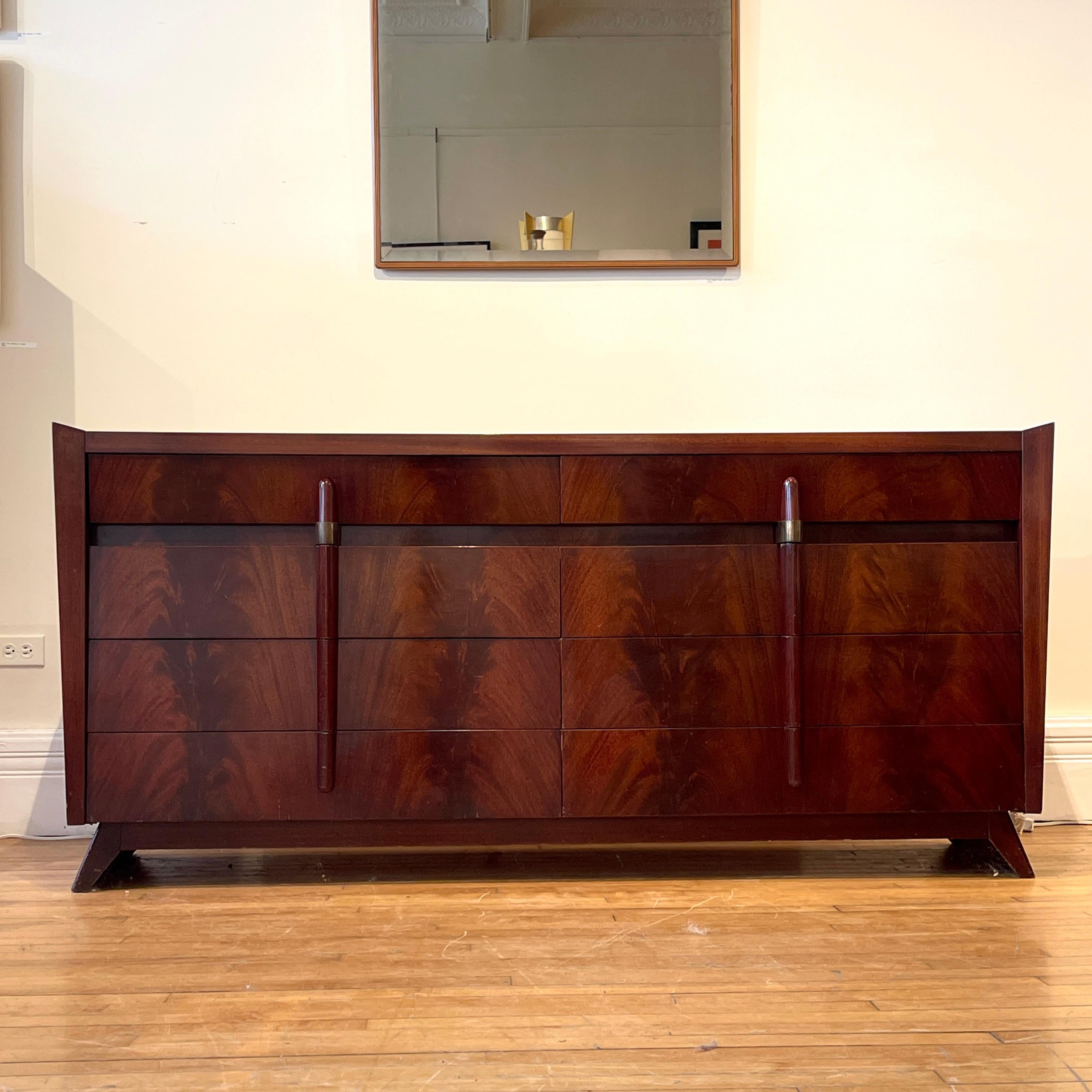 Stunning and elegant American Art Deco high gloss mahogany and brass 8 drawer dresser or credenza.