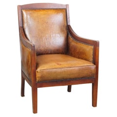 Elegante, bellissima poltrona vintage in pelle di pecora e legno dal design Art Déco